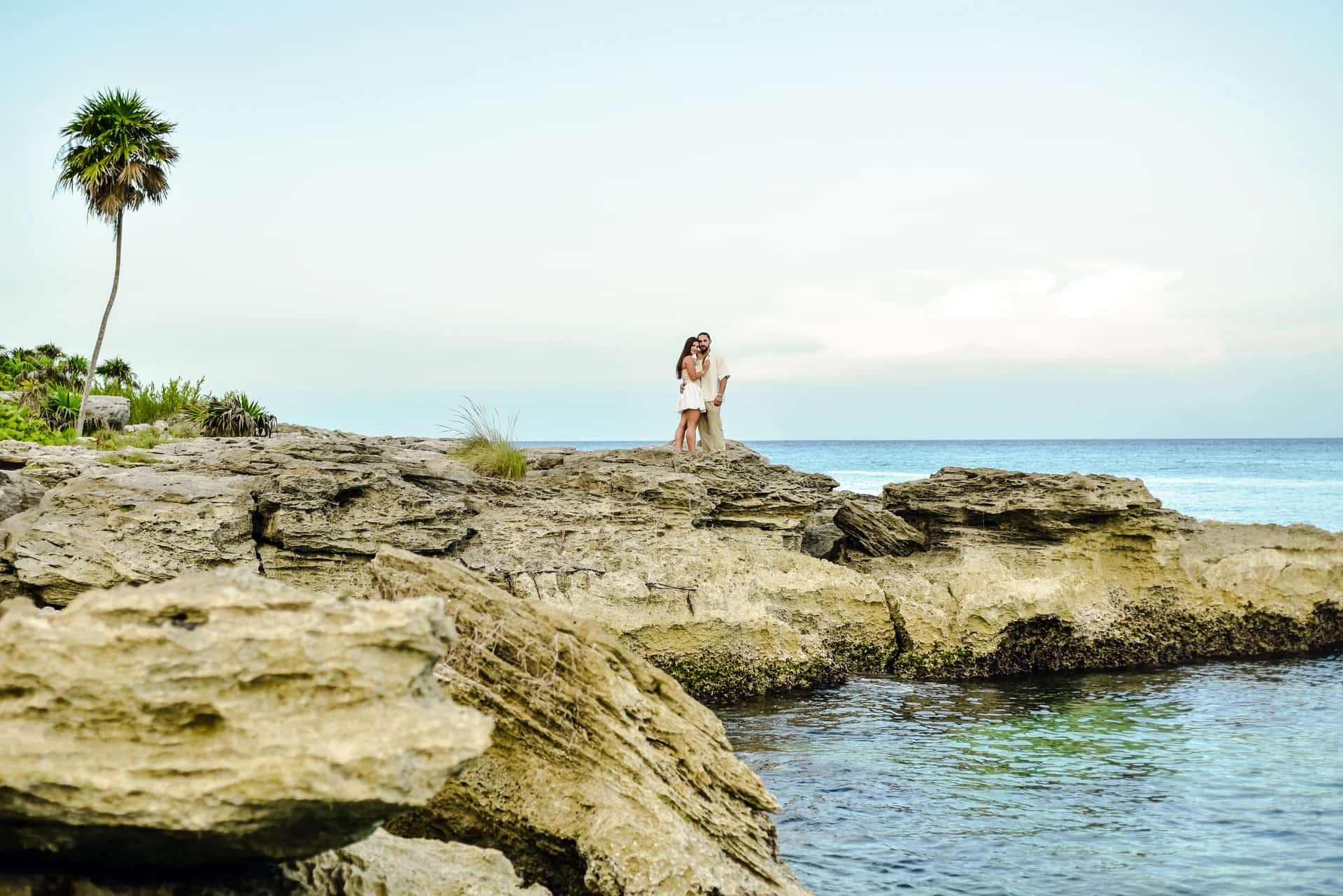 Couple on the rocky coast of Tulum