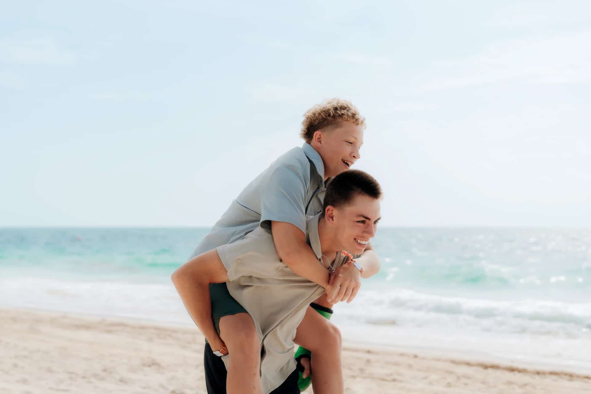 Playful family moment on the beach, Cancún