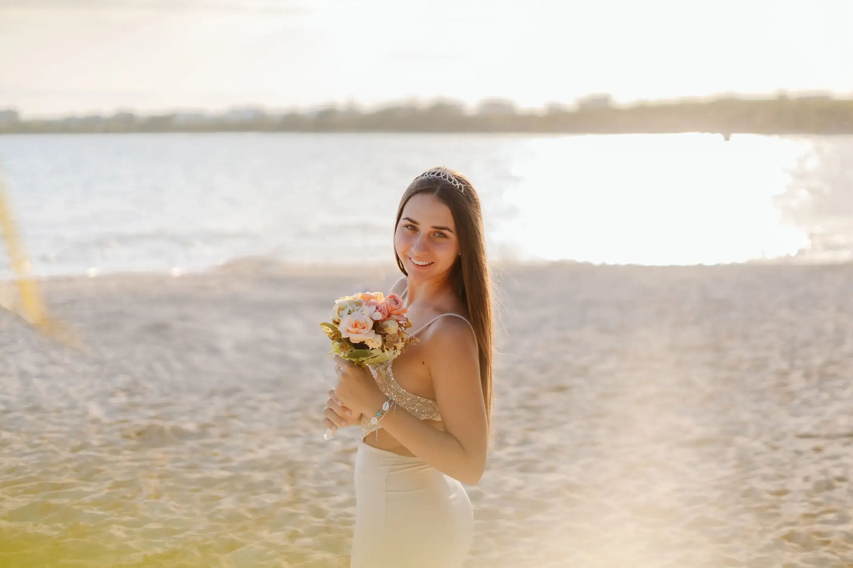 Couple on a Cancún beach at golden hour — the light that defines Cancún photography