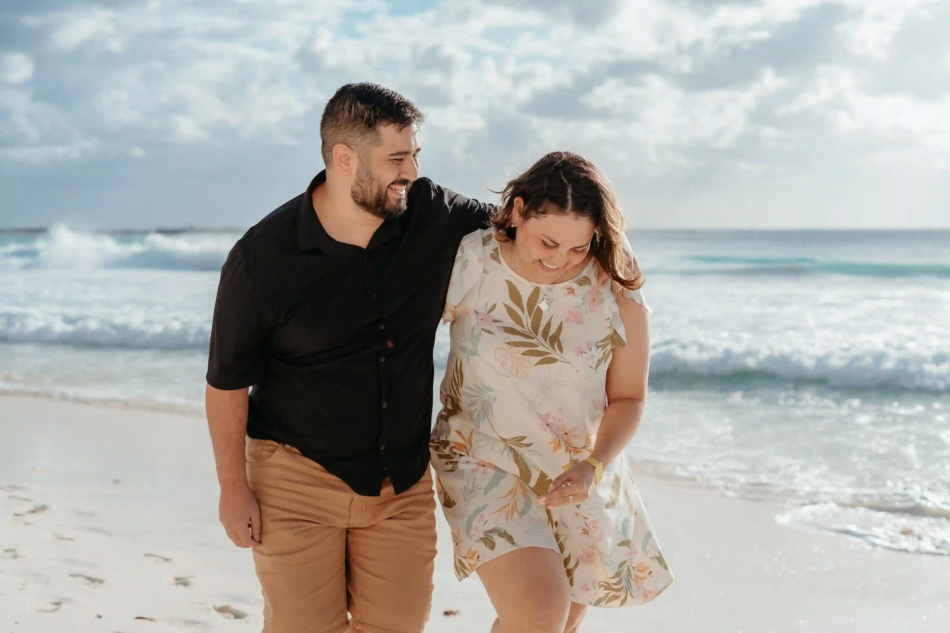Couple on Caribbean beach during vacation lifestyle session in Cancún