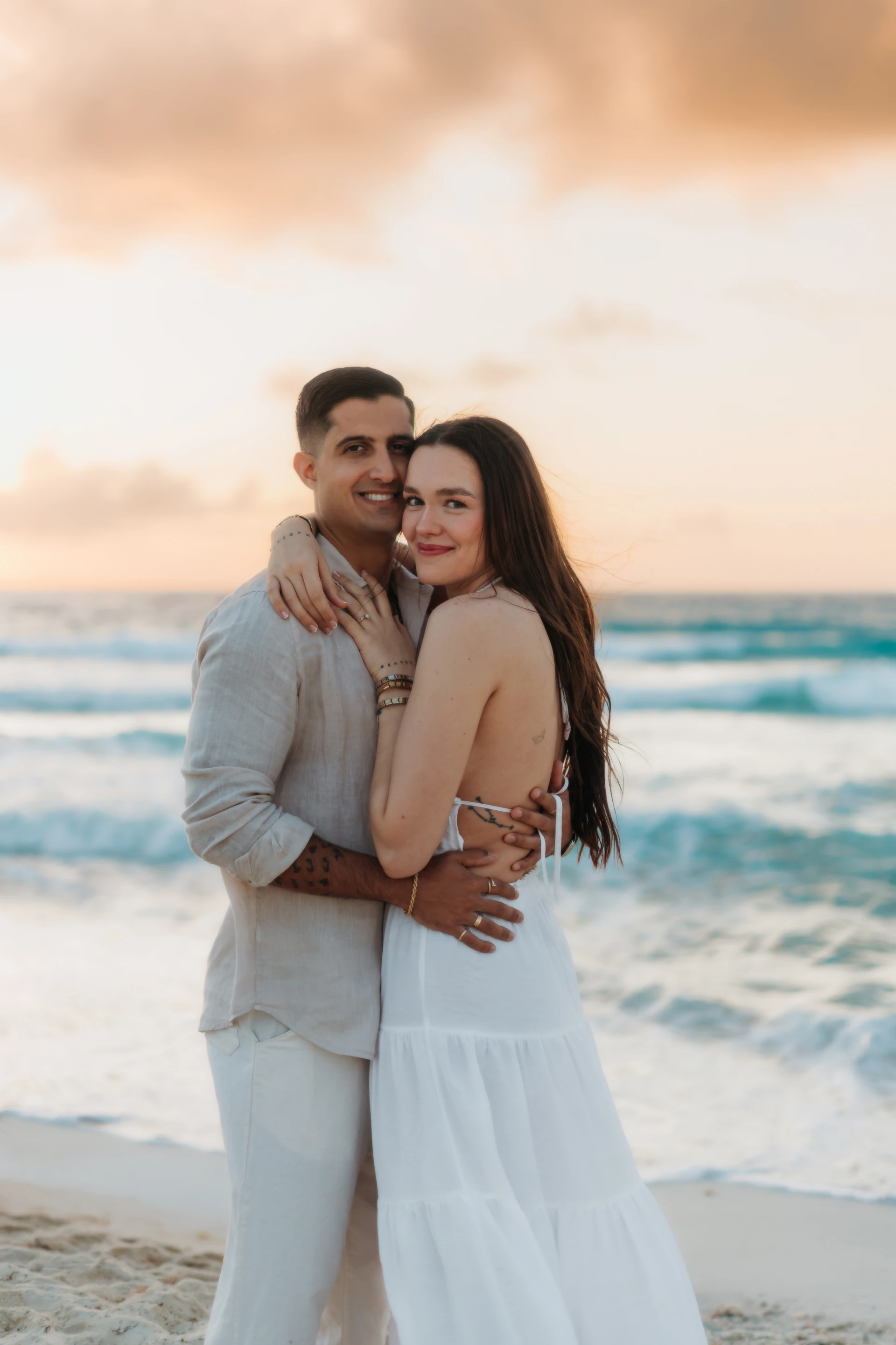 Couple embracing at sunset in Puerto Morelos