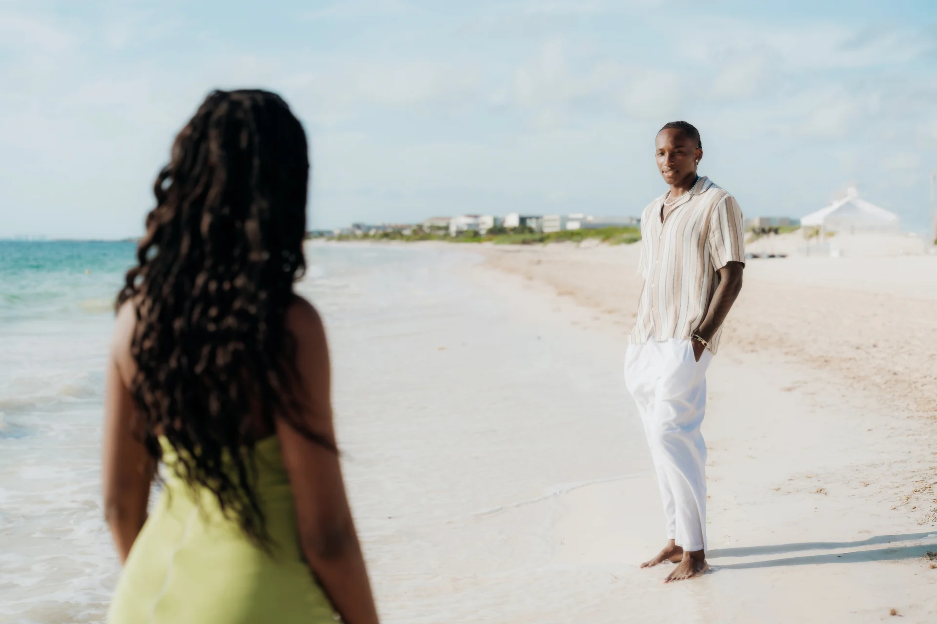 Couple walking together through the shallows, RIU Latino, Costa Mujeres