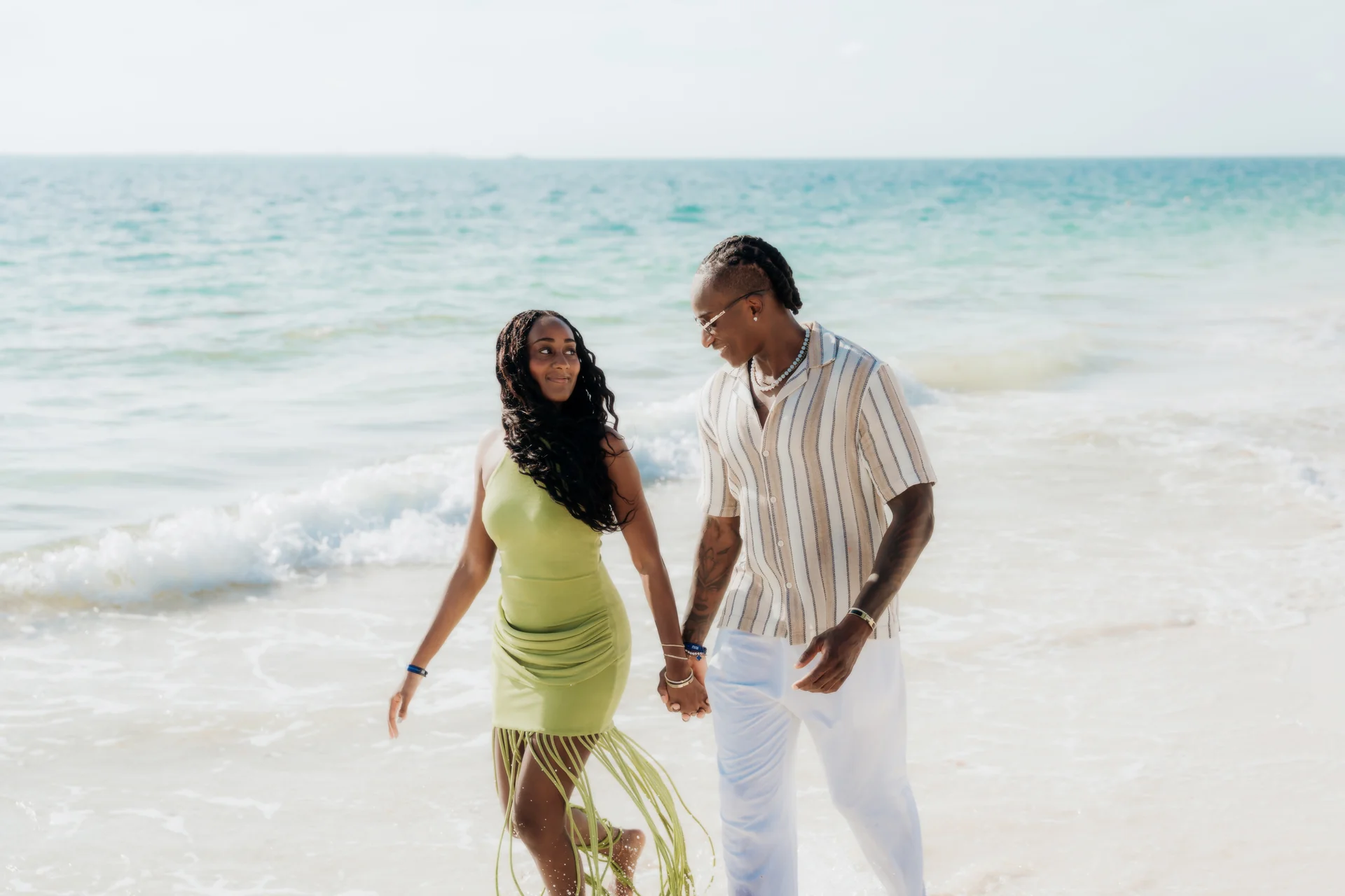 Couple wrapped together at the shoreline, RIU Latino, Costa Mujeres