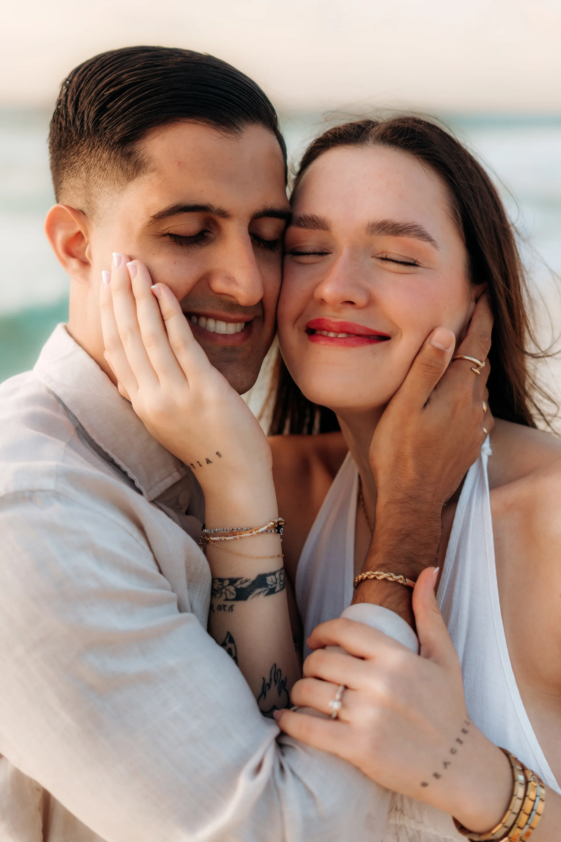 Couple portrait at the edge of the water, Playa Delfines, Cancún