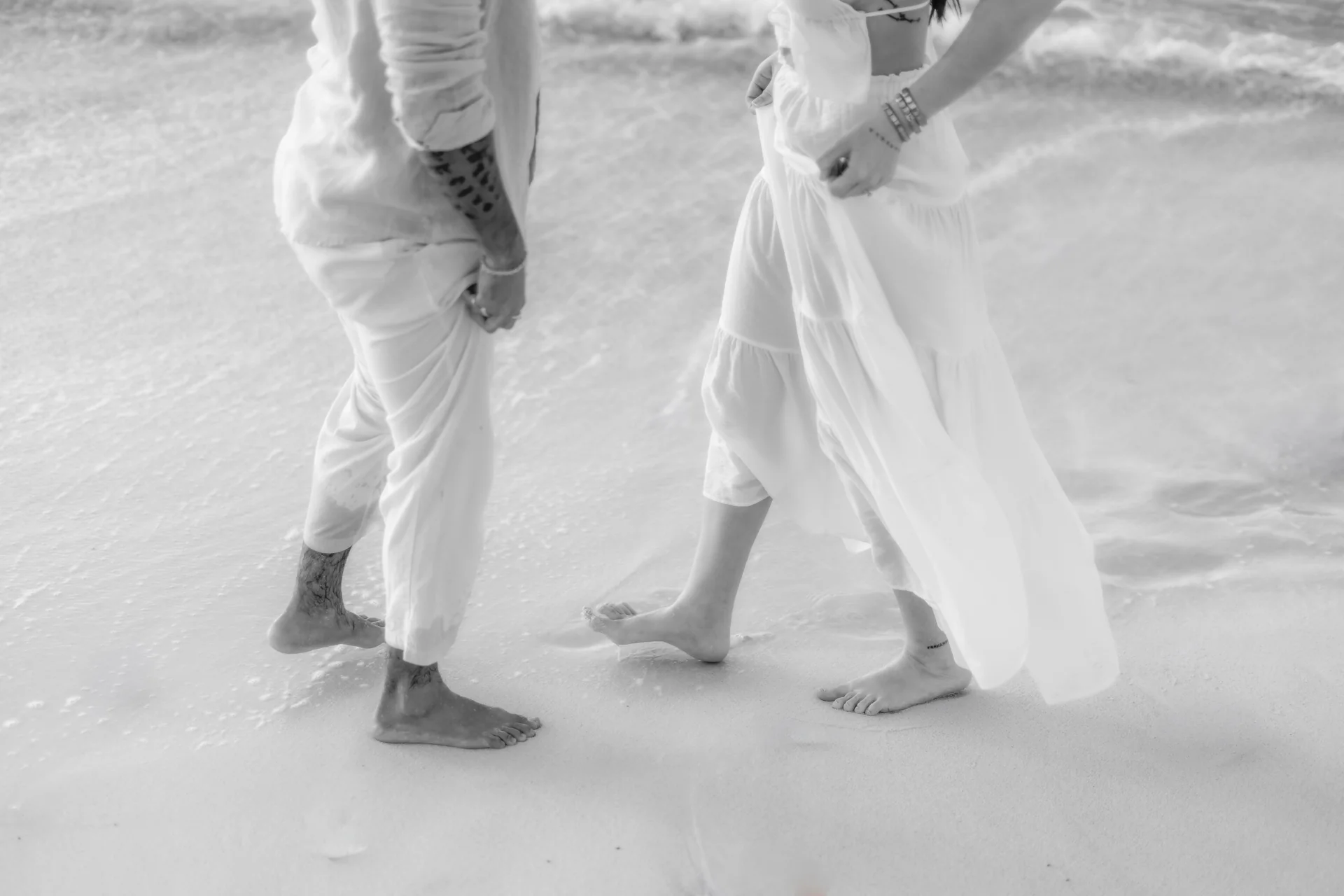 Couple close together against the sea, Playa Delfines, Cancún