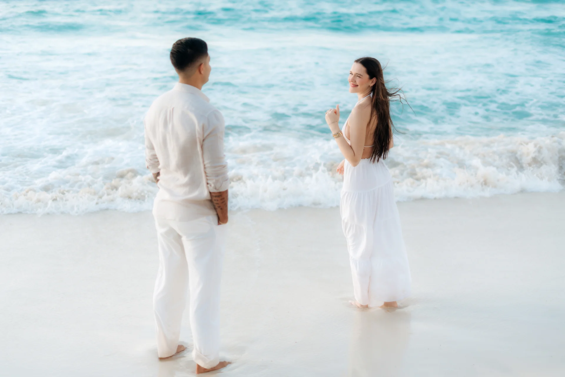 Couple kissing on the empty beach, Playa Delfines, Cancún