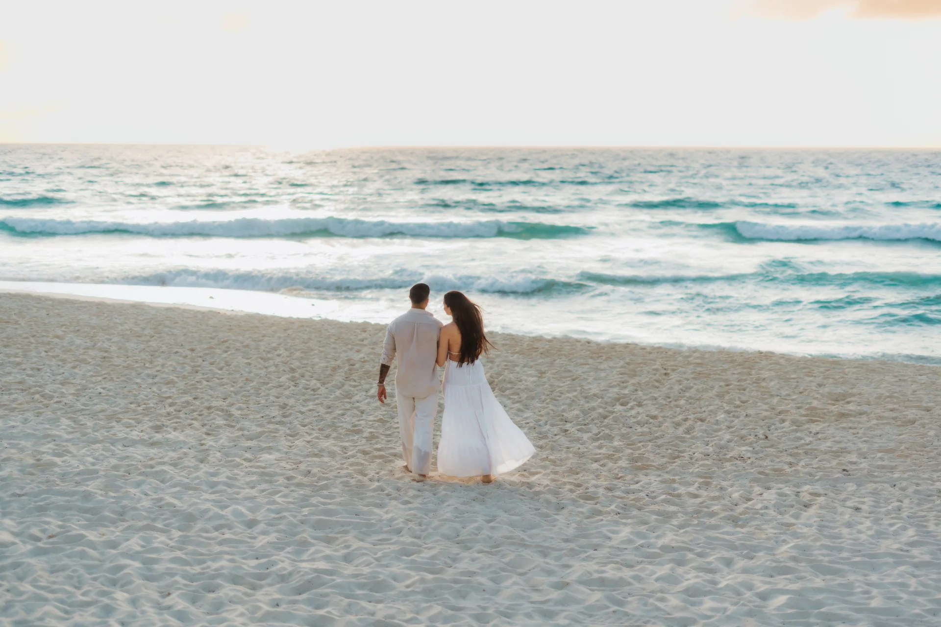 Couple dancing close on the beach, Playa Delfines, Cancún