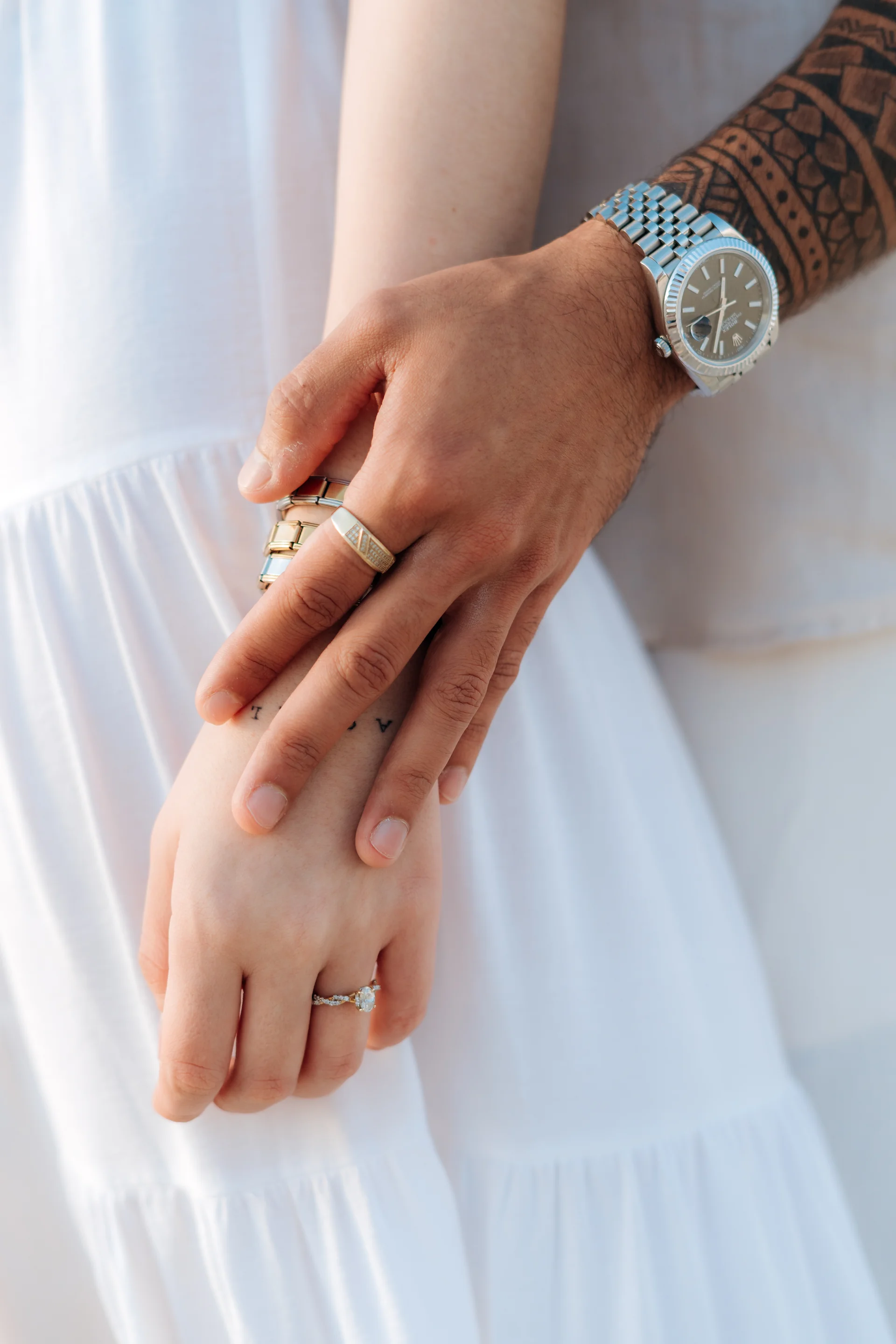 Couple embracing in the soft morning light, Playa Delfines, Cancún