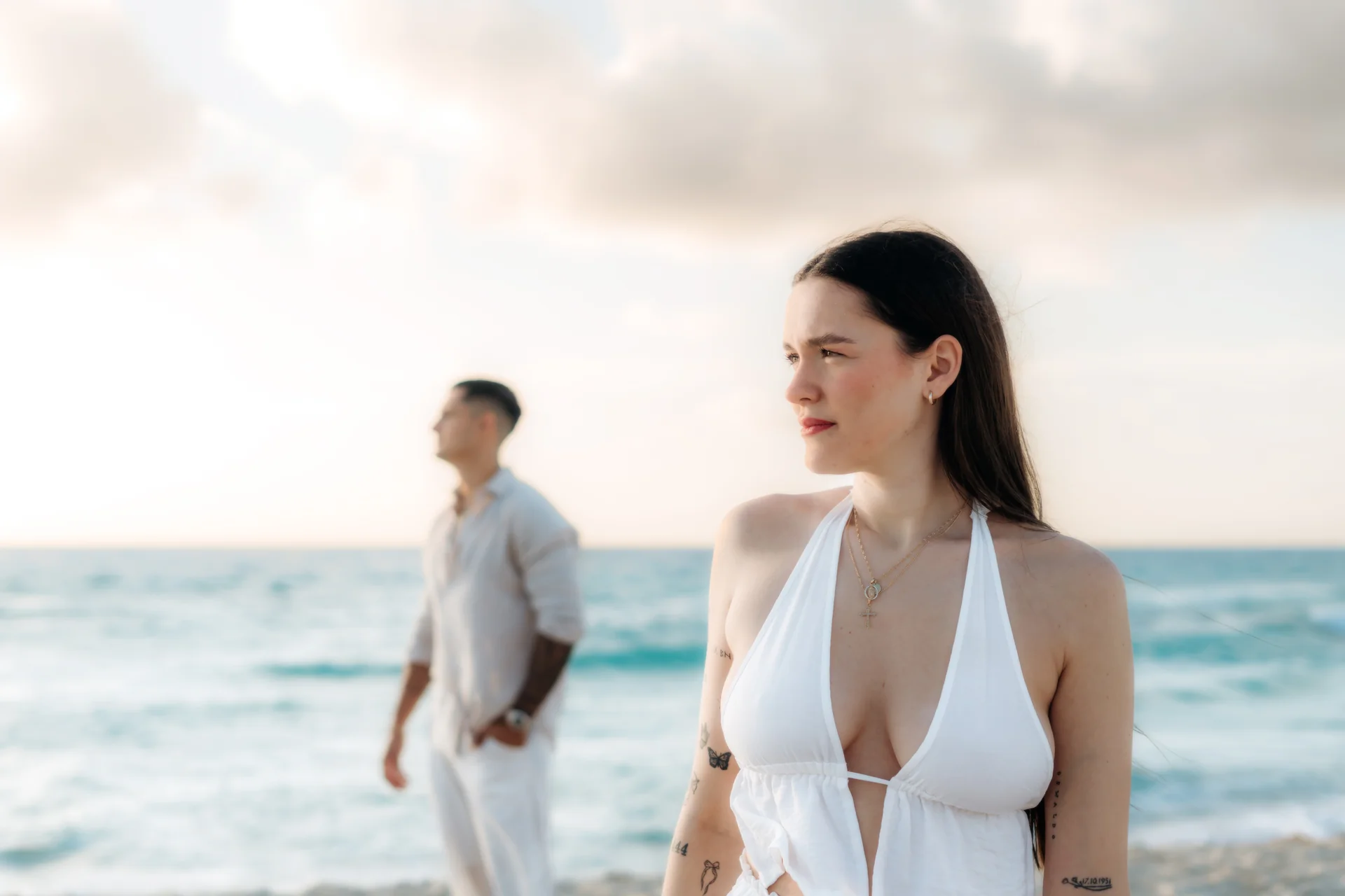 Candid couple moment on the quiet beach, Playa Delfines, Cancún