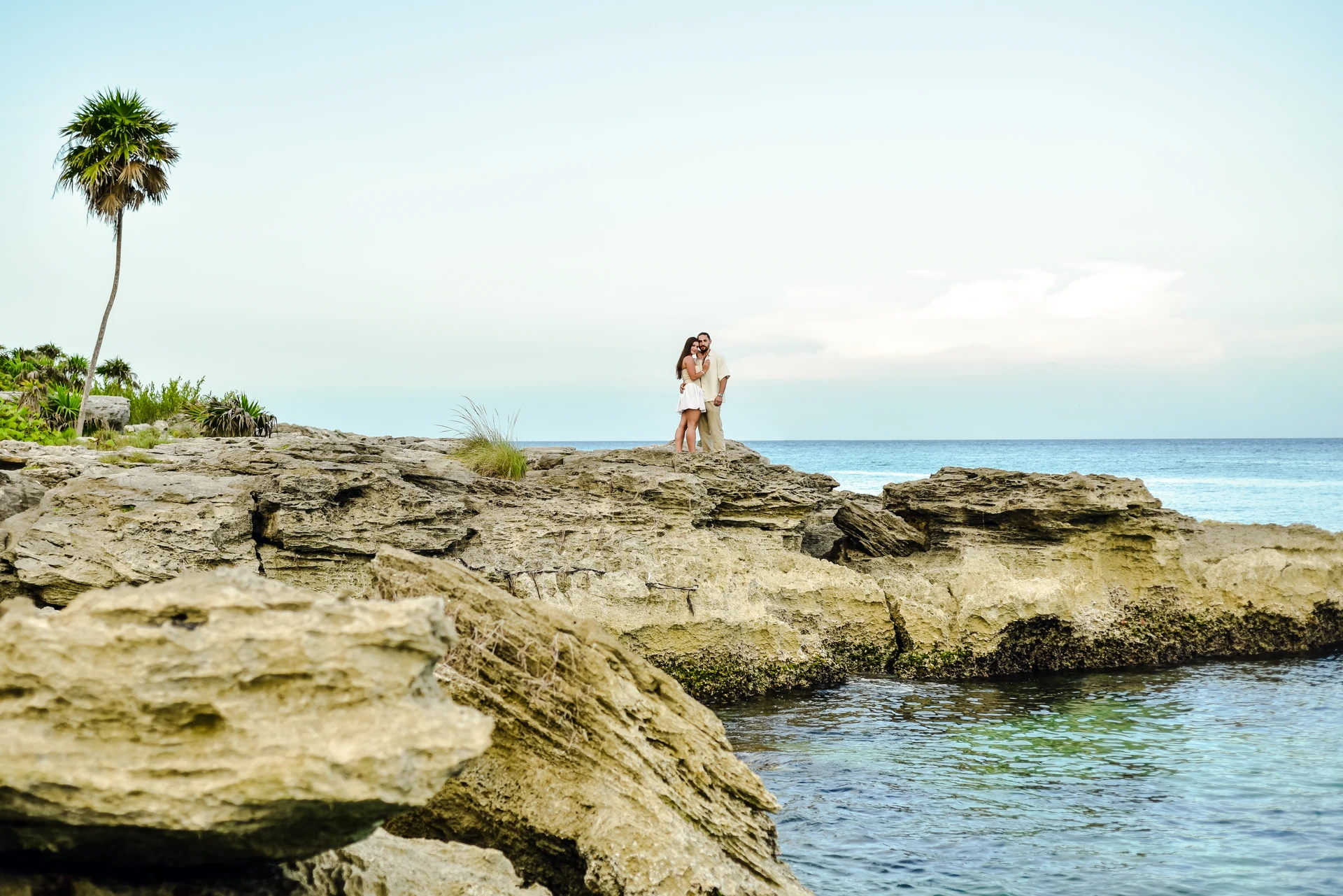 Couple on the rocky coast of Tulum