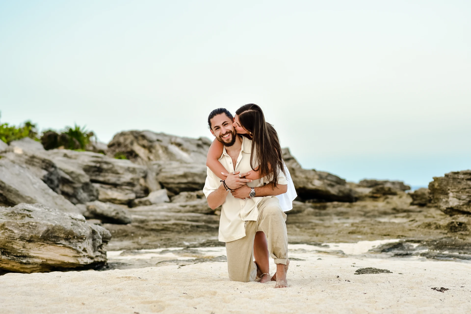 Couple by the sea in Tulum