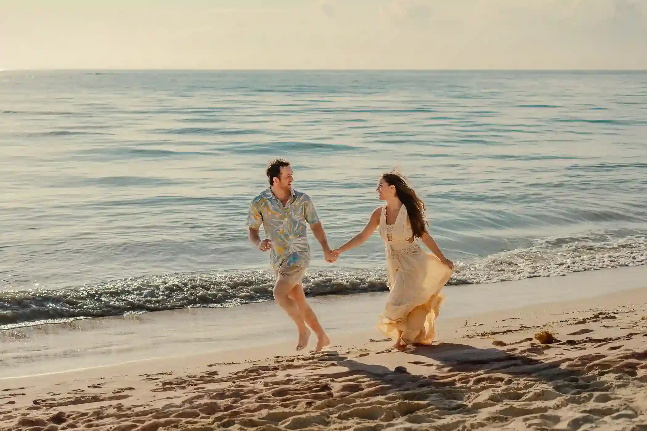 Engagement photography on the white sand of a Cancún beach