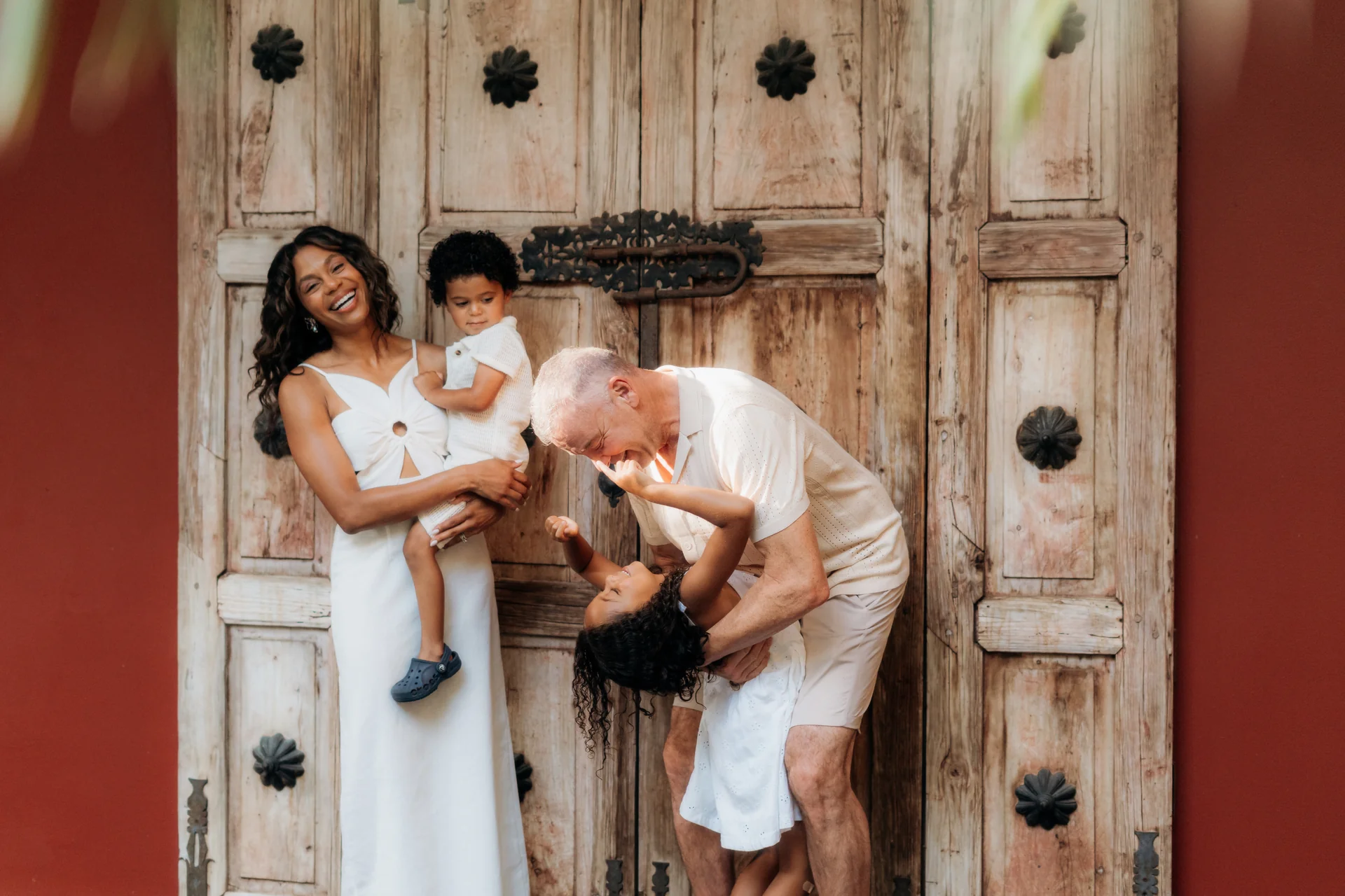 Mother and father framing their child between them, Banyan Tree Mayakoba, Riviera Maya