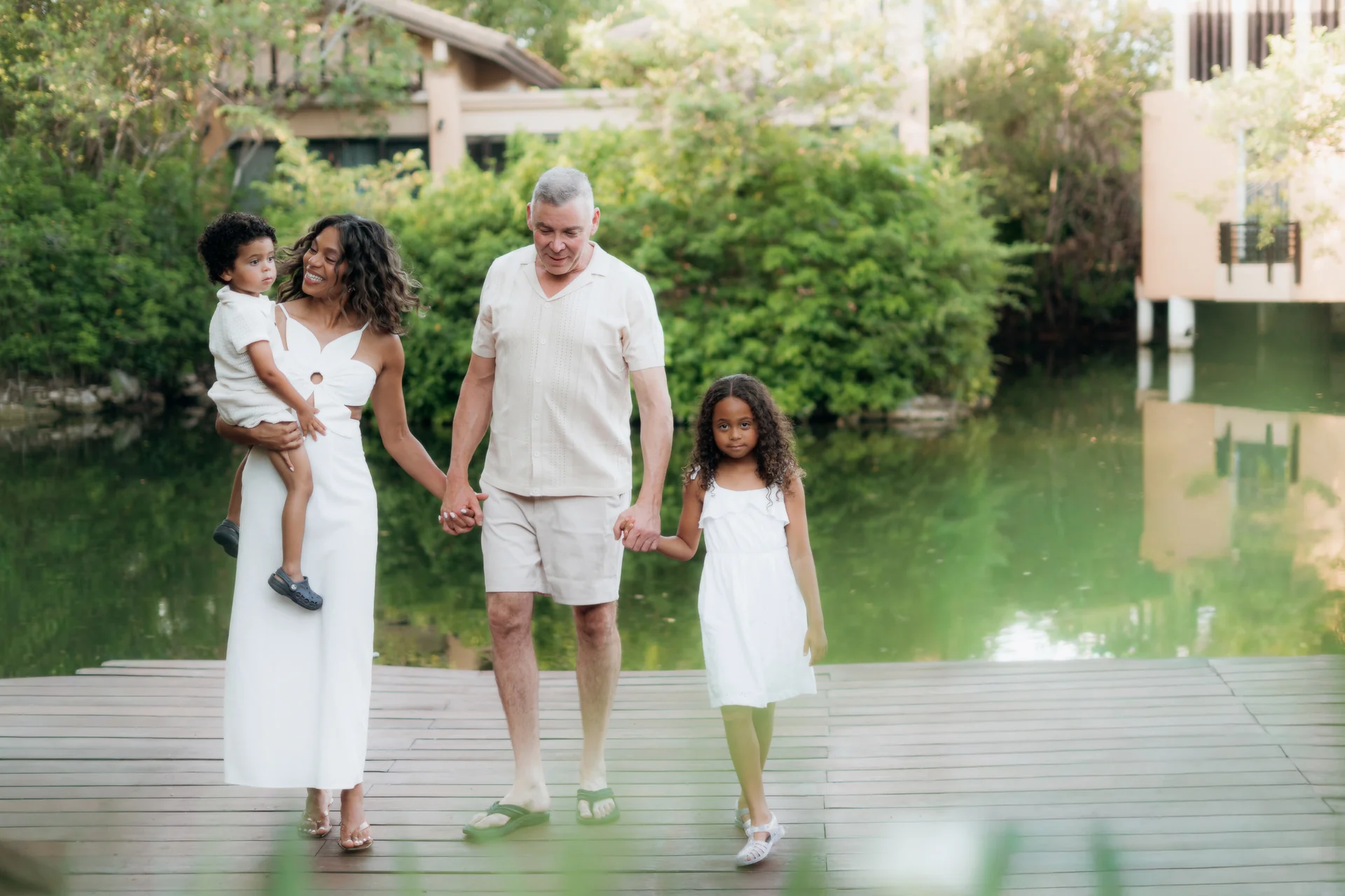 Family gathered on the sand in the early light, Banyan Tree Mayakoba, Riviera Maya