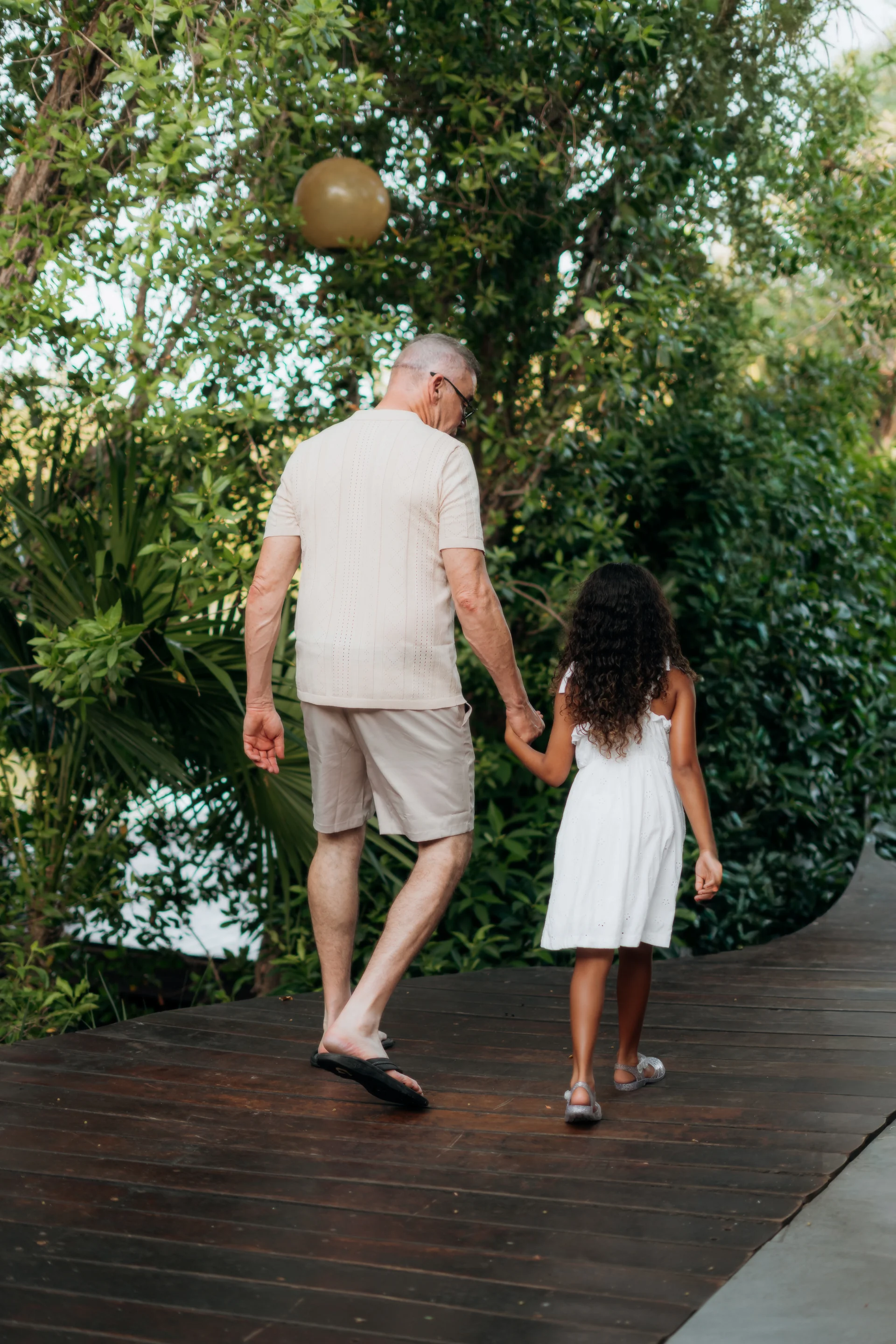 Family walking together along the shoreline, Banyan Tree Mayakoba, Riviera Maya