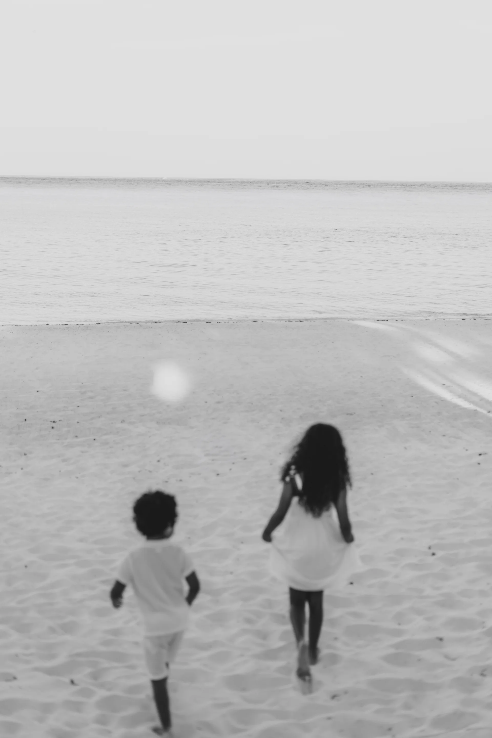 Mother holding her baby by the water, Banyan Tree Mayakoba, Riviera Maya