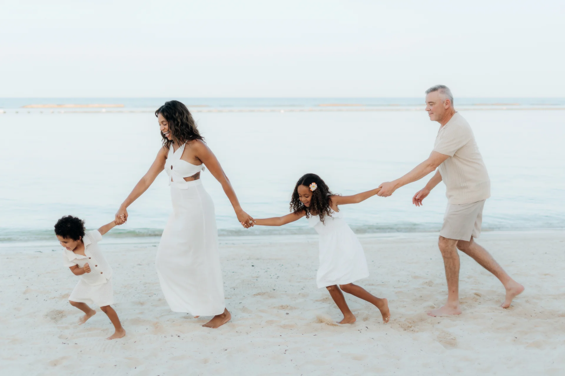 Toddler taking steps across the beach, Banyan Tree Mayakoba, Riviera Maya