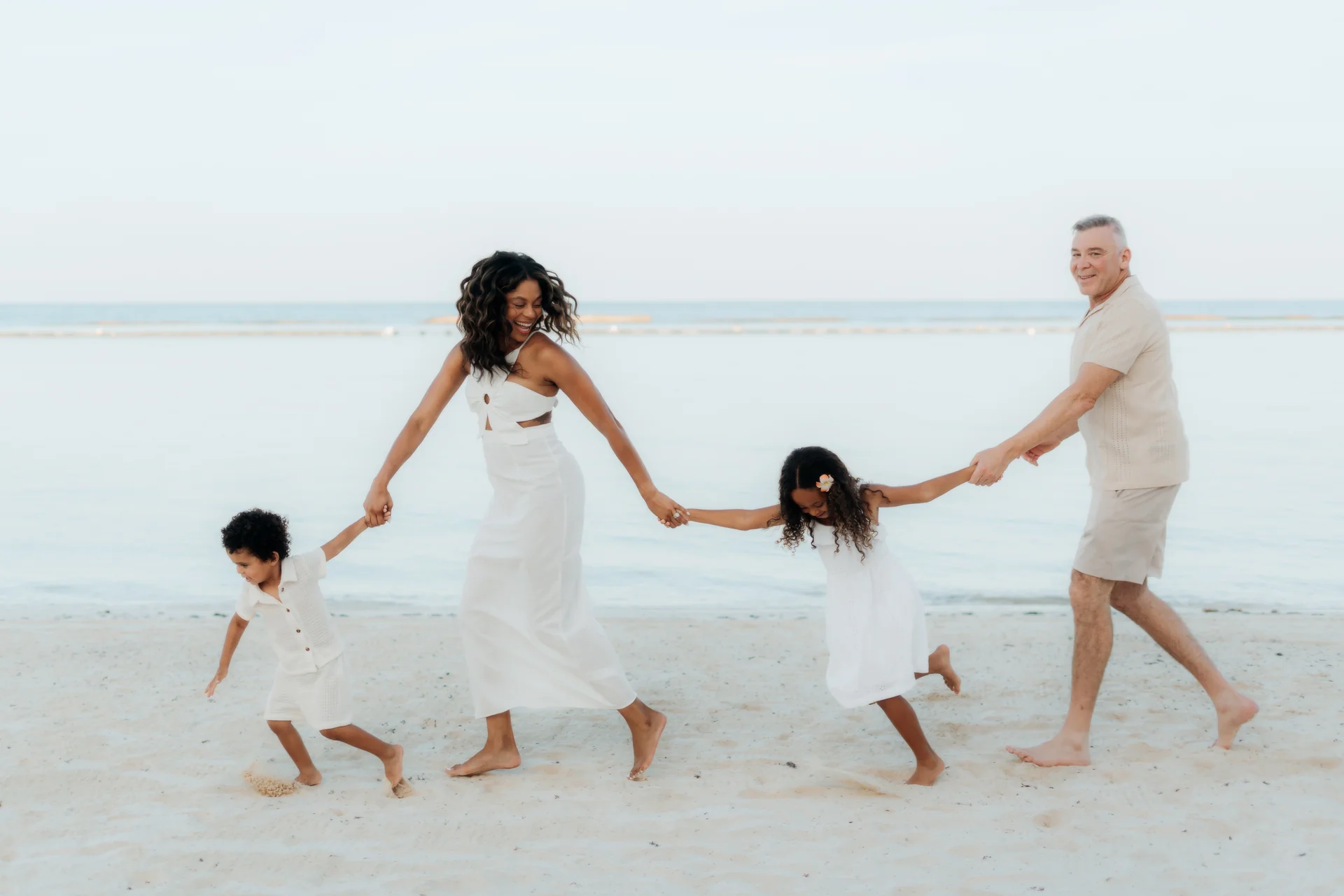 Parents kissing their child on the cheek, Banyan Tree Mayakoba, Riviera Maya