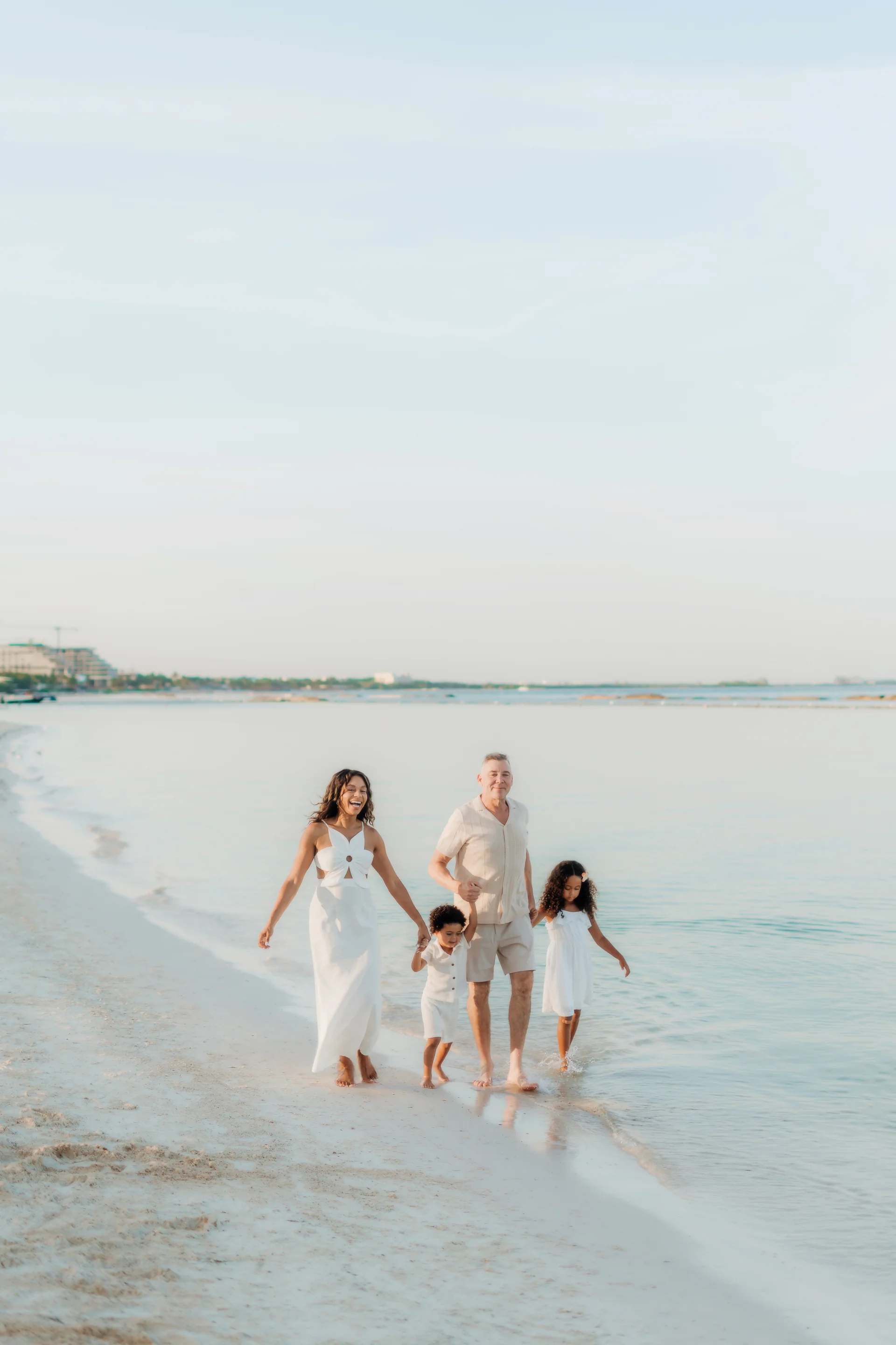 Family walking away down the beach, Banyan Tree Mayakoba, Riviera Maya