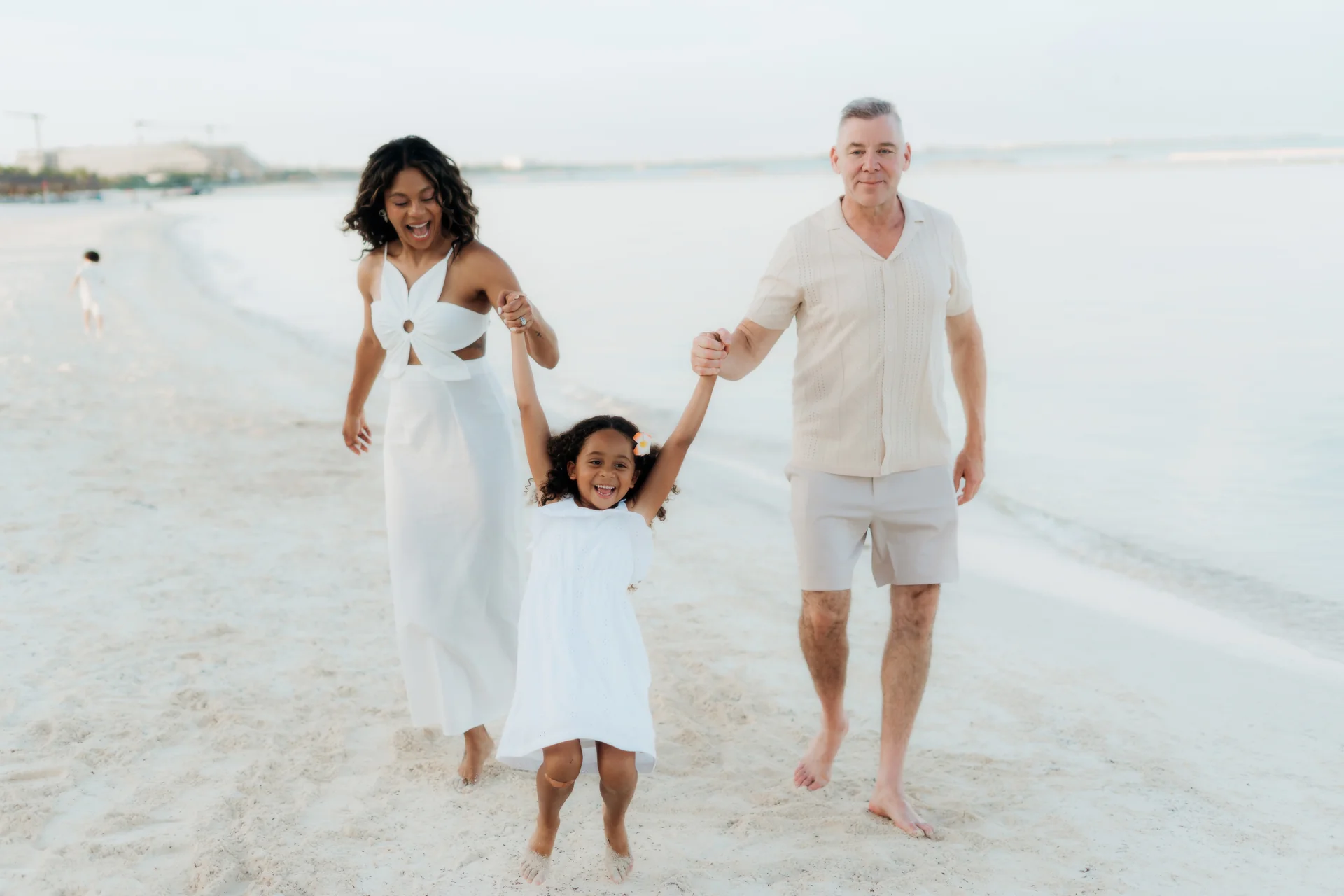 Family playing in the sand together, Banyan Tree Mayakoba, Riviera Maya