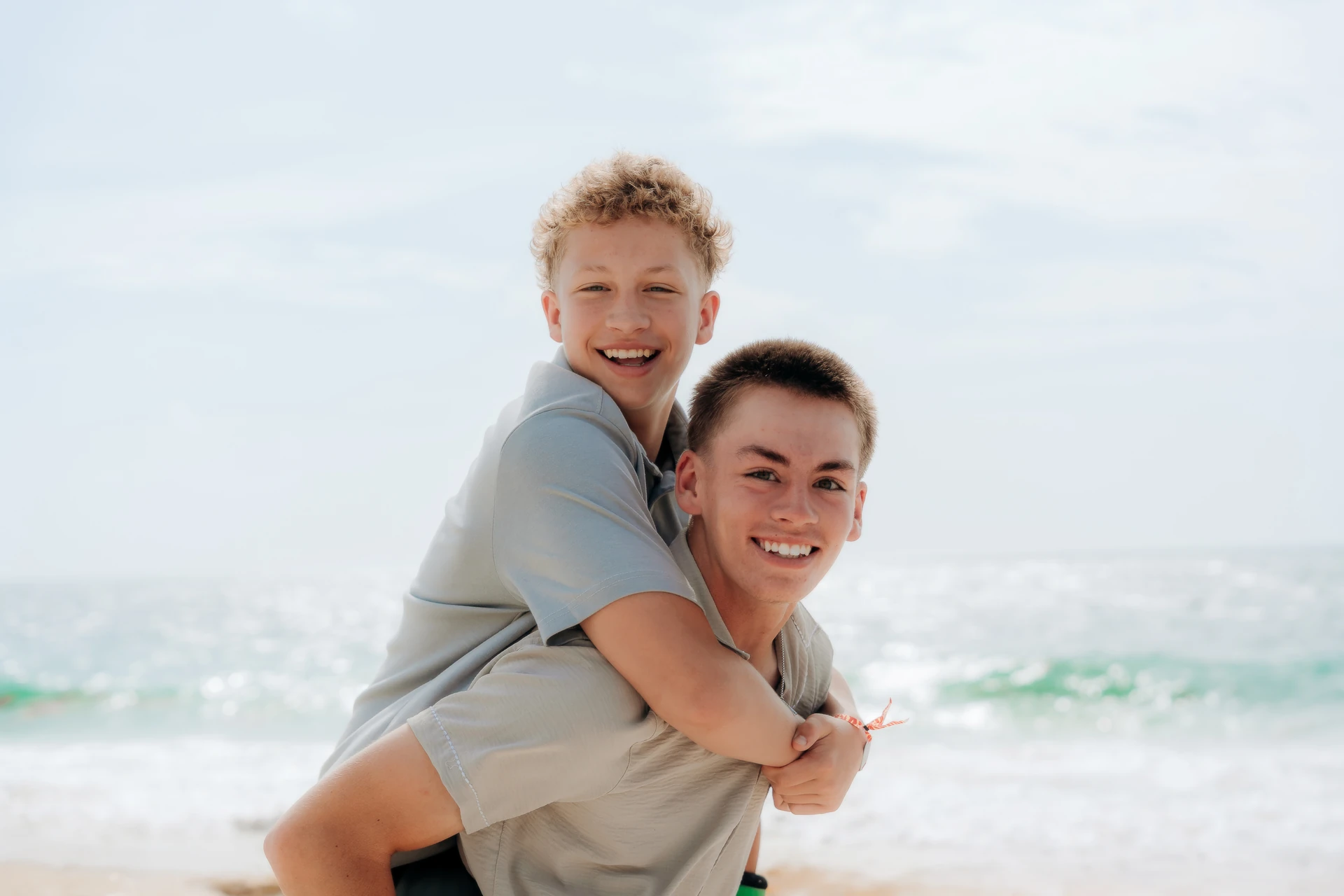 Two brothers on a Cancún beach