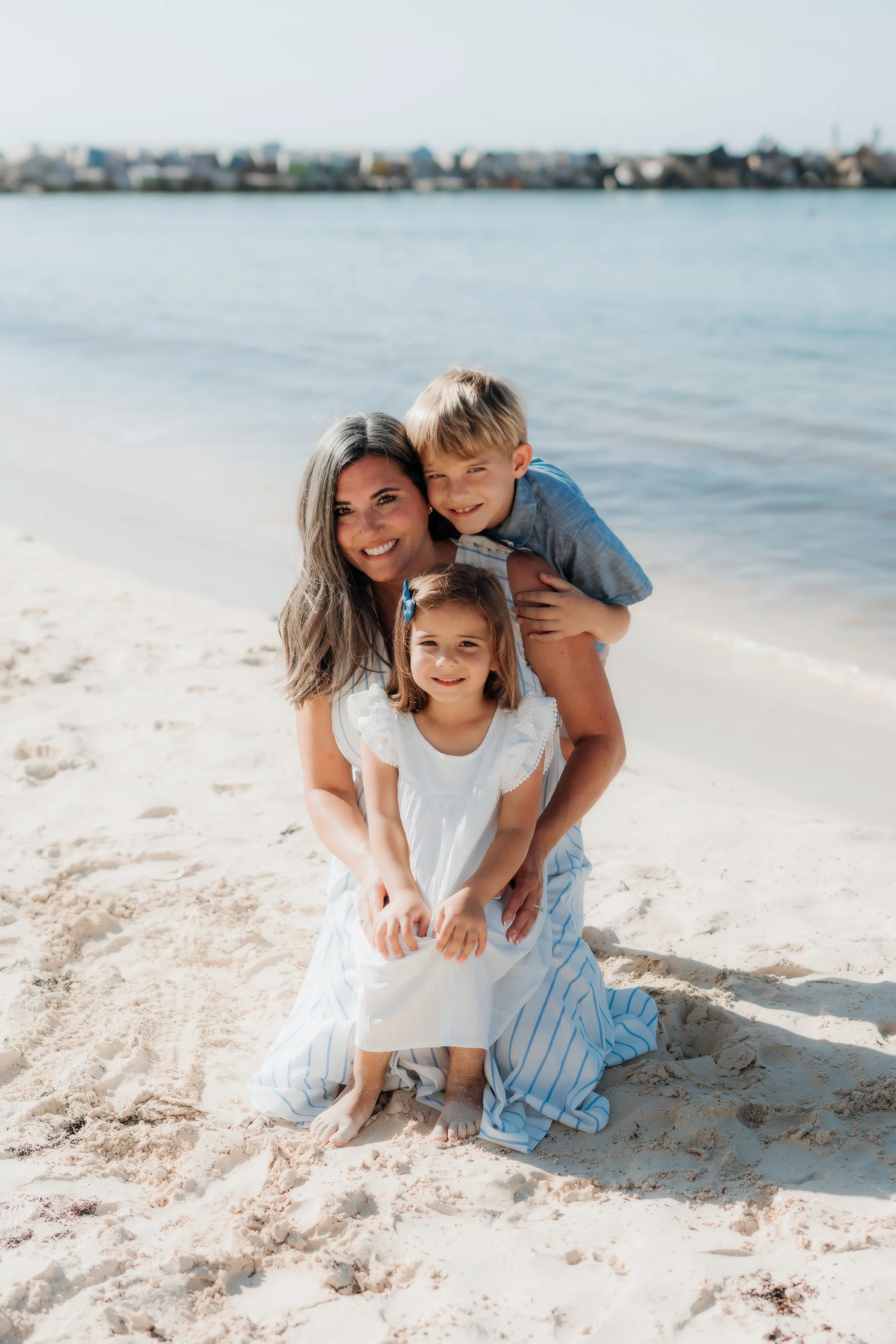 Family embracing on the sand, Hyatt Ziva, Cancún