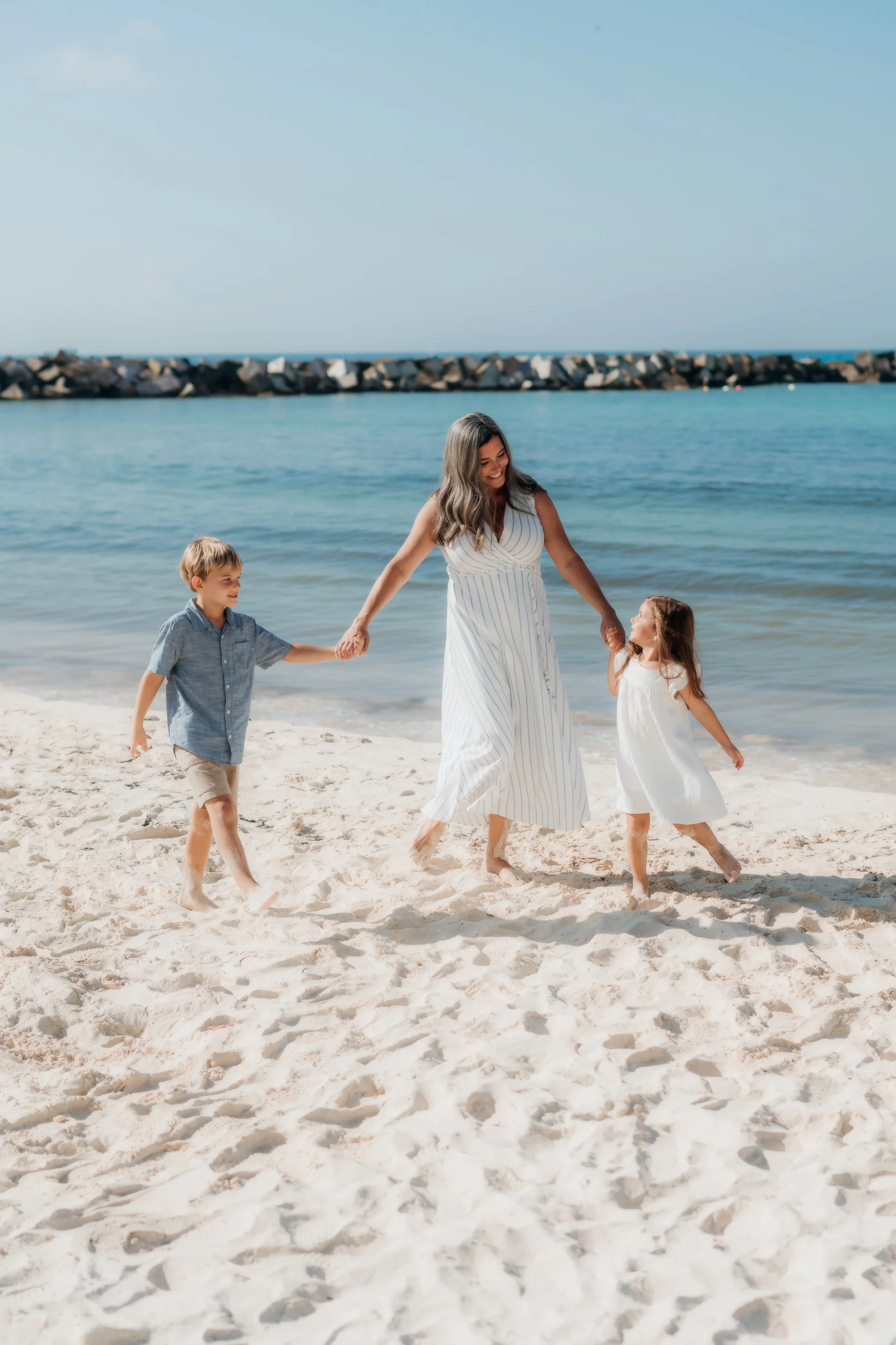 Parents laughing with their child in the breeze, Hyatt Ziva, Cancún