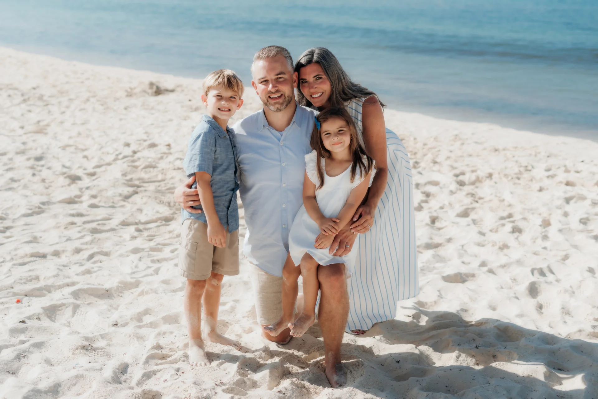 Family holding hands in a row on the sand, Hyatt Ziva, Cancún