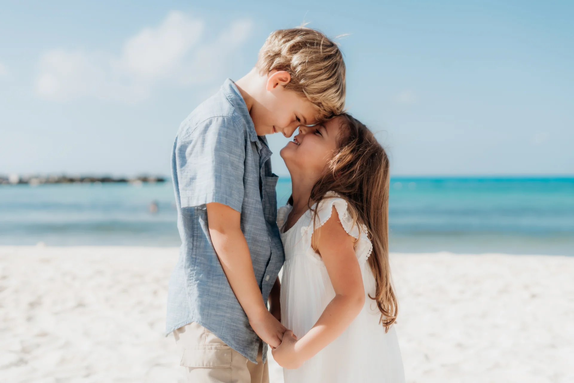 Mother holding her child close in the breeze, Hyatt Ziva, Cancún