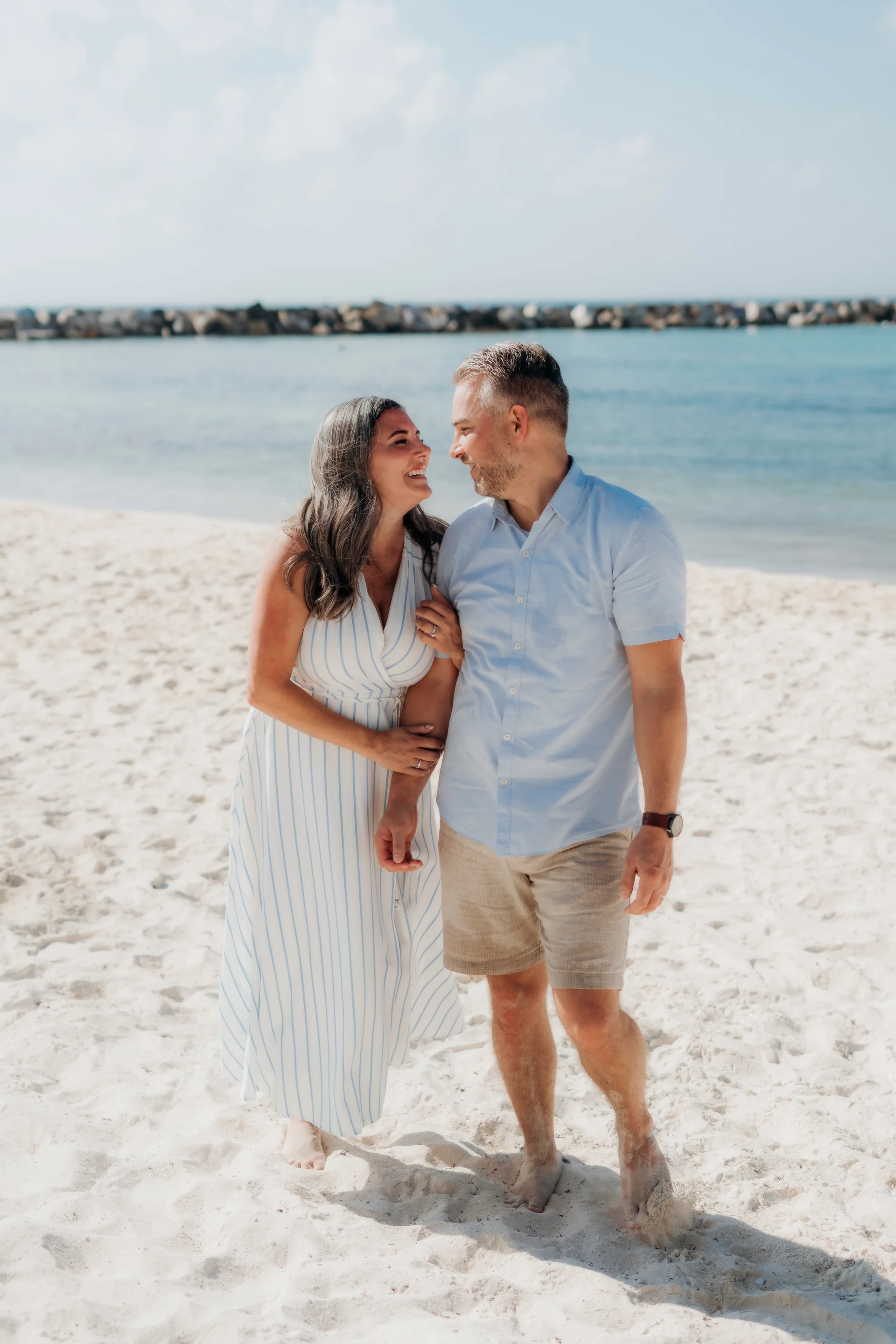 Family standing together at the water's edge, Hyatt Ziva, Cancún