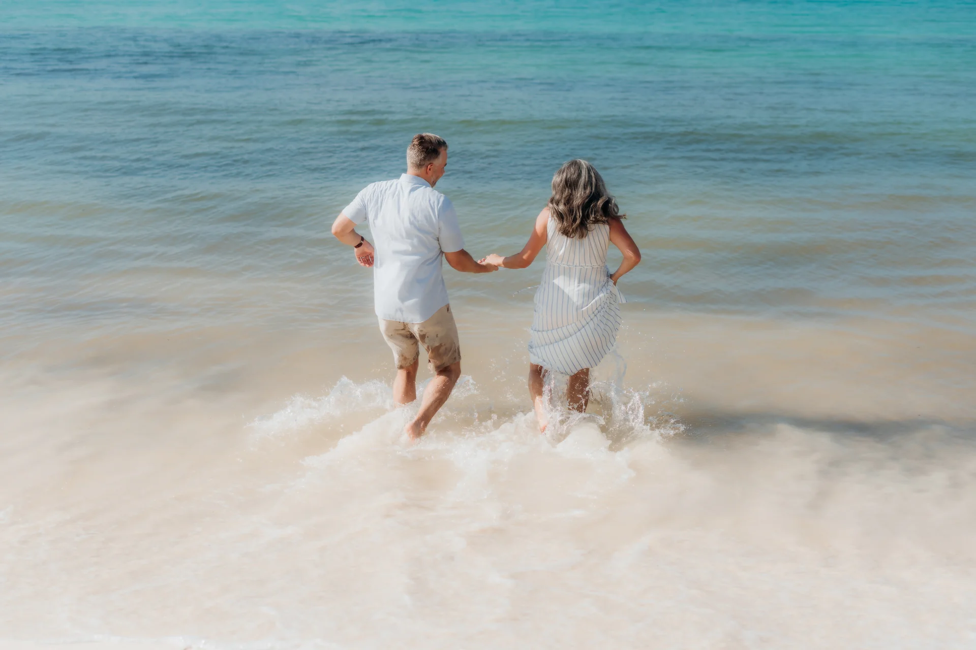Mother holding her baby by the water, Hyatt Ziva, Cancún