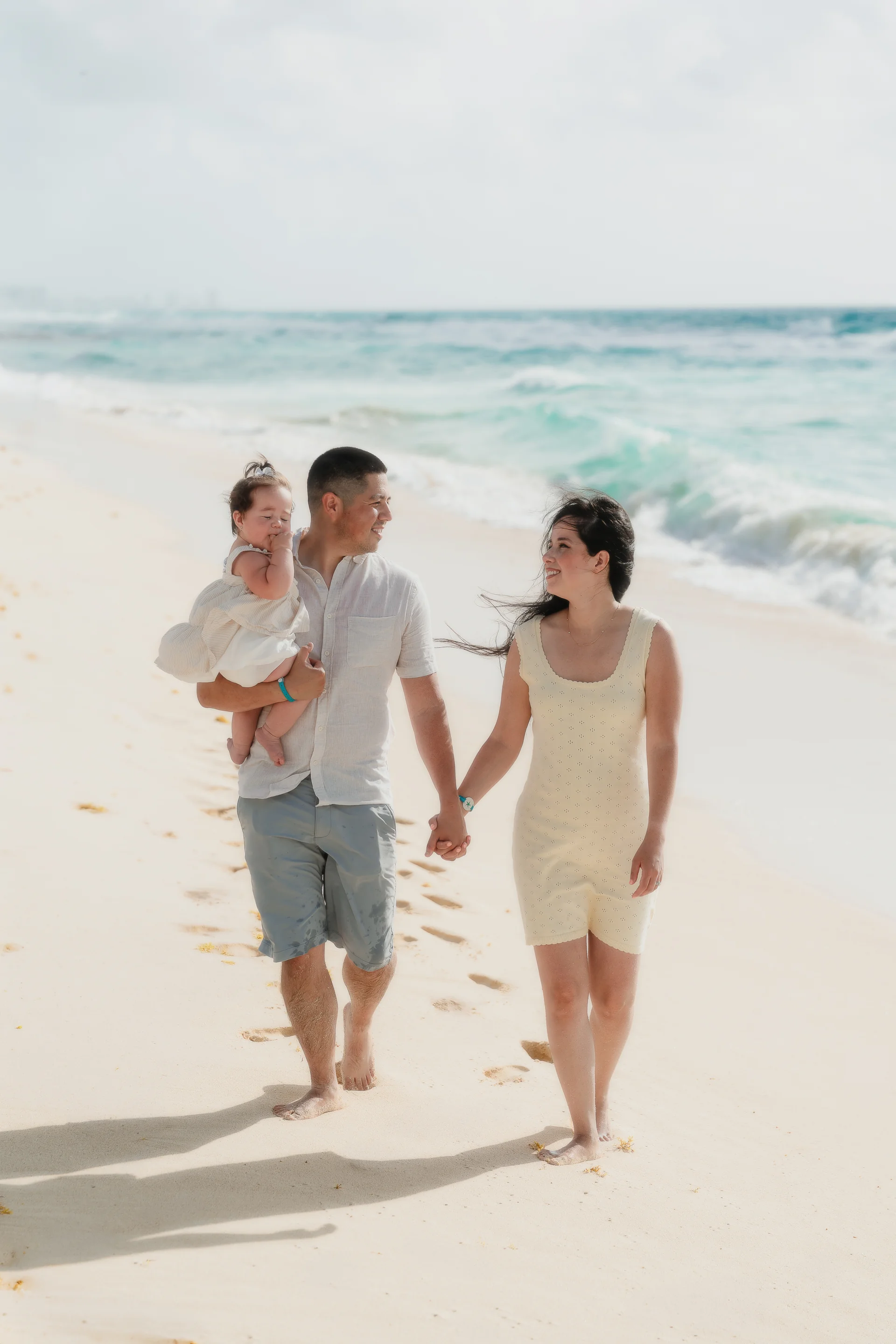 Family playing near the lagoon, Playa Delfines, Cancún