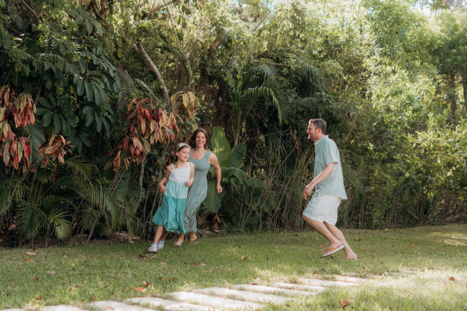 Family portrait with the ocean behind them, Rosewood Mayakoba, Riviera Maya