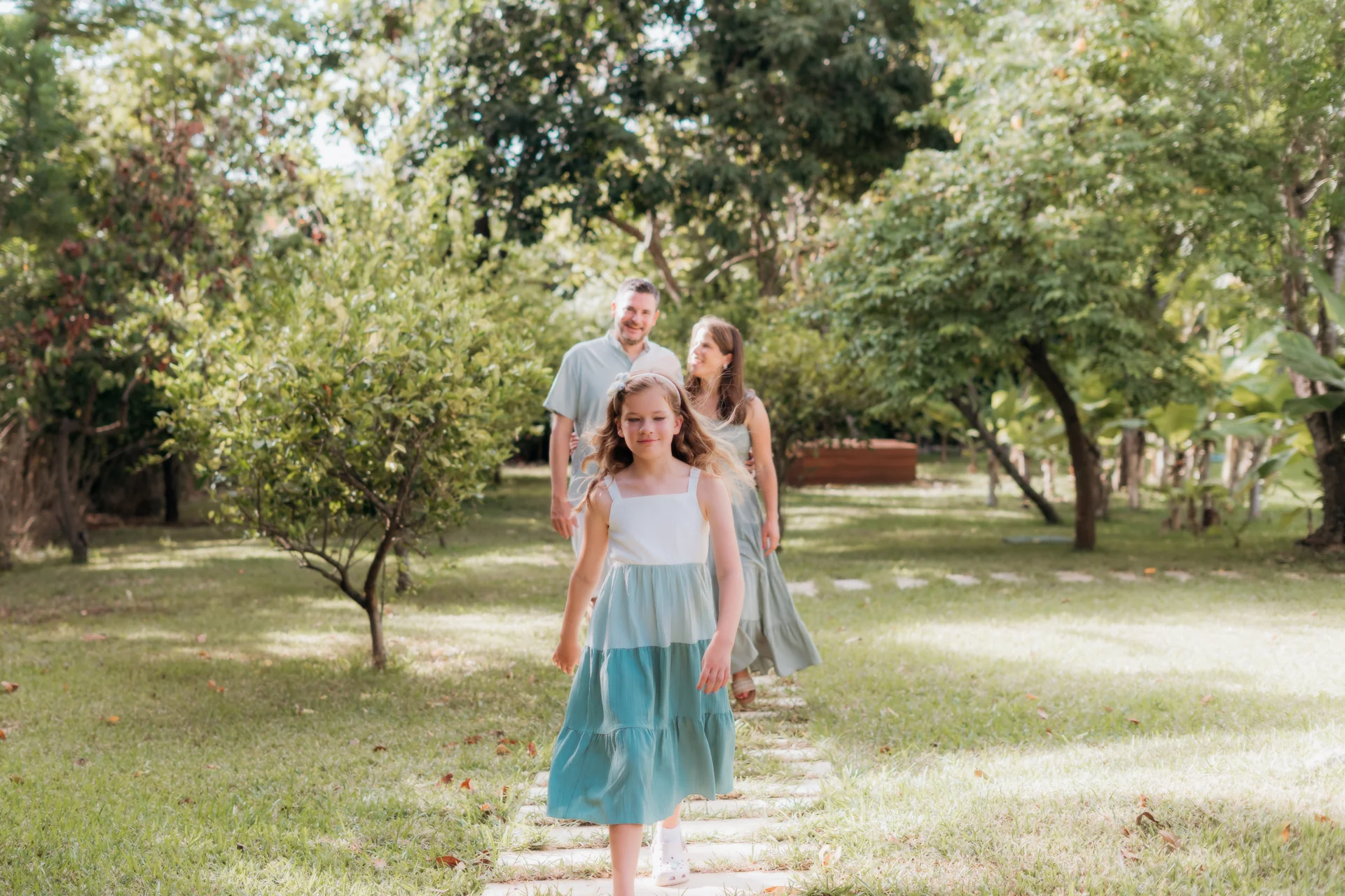 Family walking the garden path together, Rosewood Mayakoba, Riviera Maya