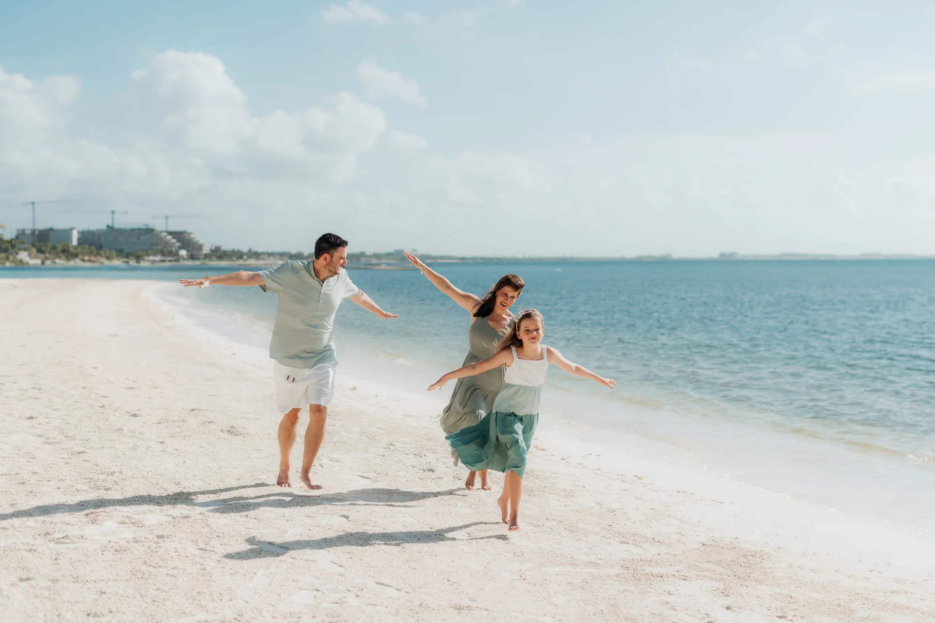 Child reaching up for a parent's hand, Rosewood Mayakoba, Riviera Maya