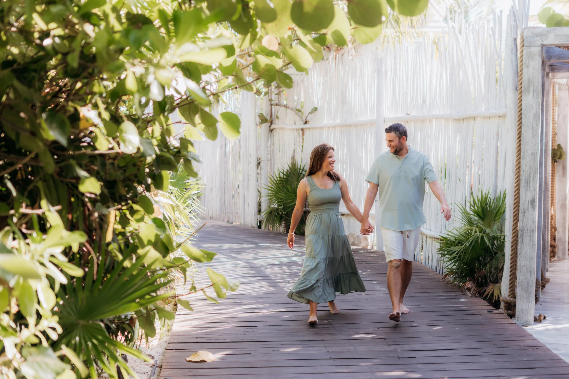 Parents holding hands with their child between them, Rosewood Mayakoba, Riviera Maya
