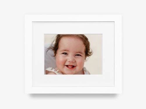 Matted white frame with a Roots portrait