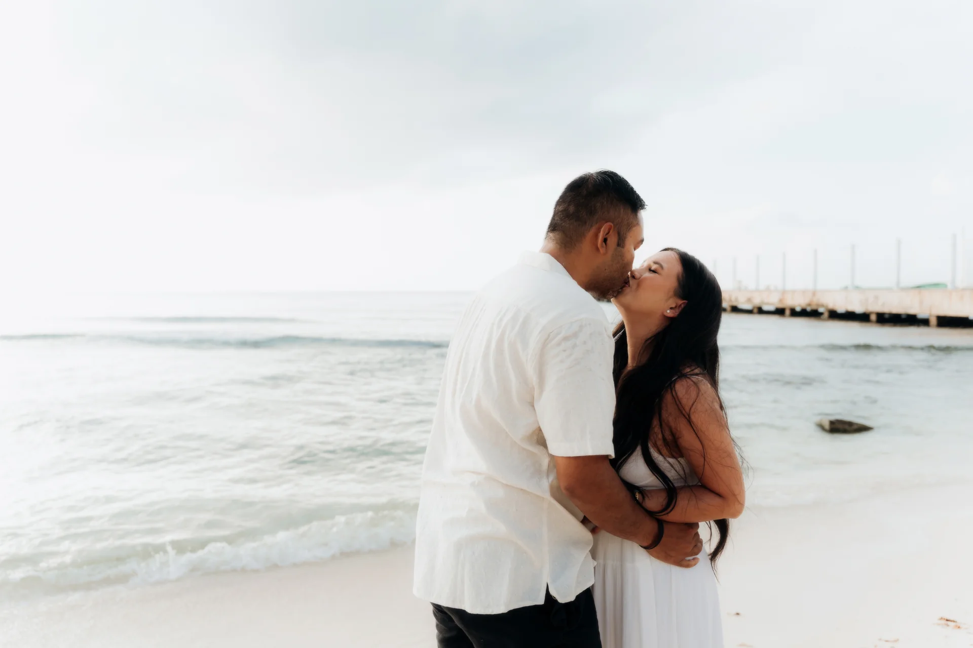 Couple embracing with the water behind them, Hyatt Vivid, Playa del Carmen