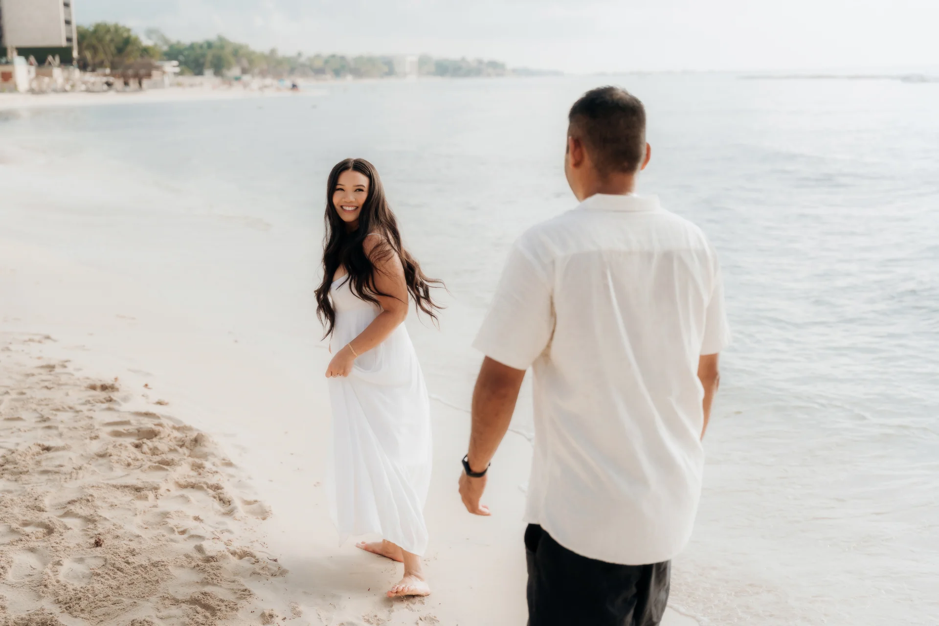 Couple embracing at the water's edge after saying yes, Hyatt Vivid, Playa del Carmen