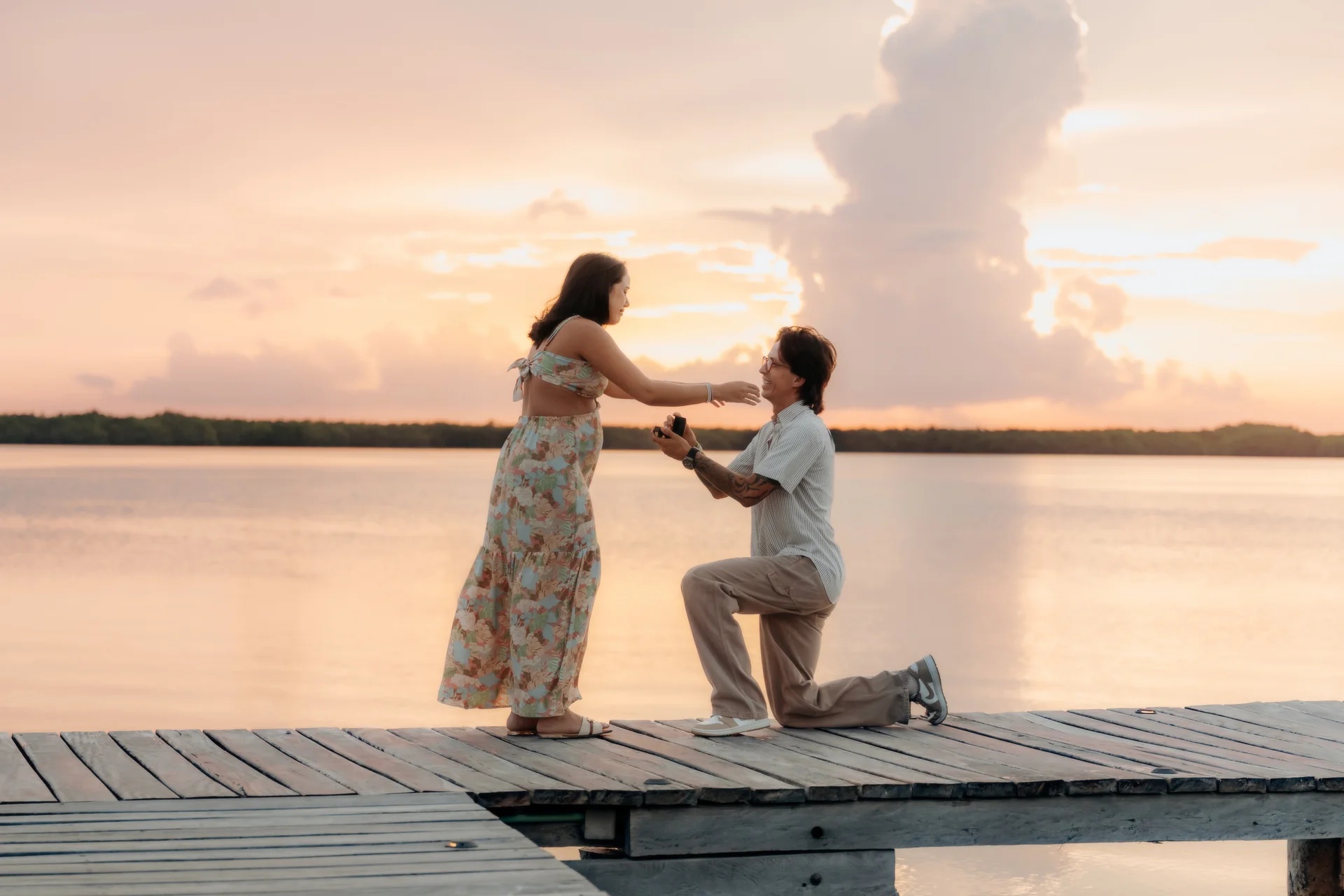 Engaged couple smiling at each other, Navios restaurant, Cancún