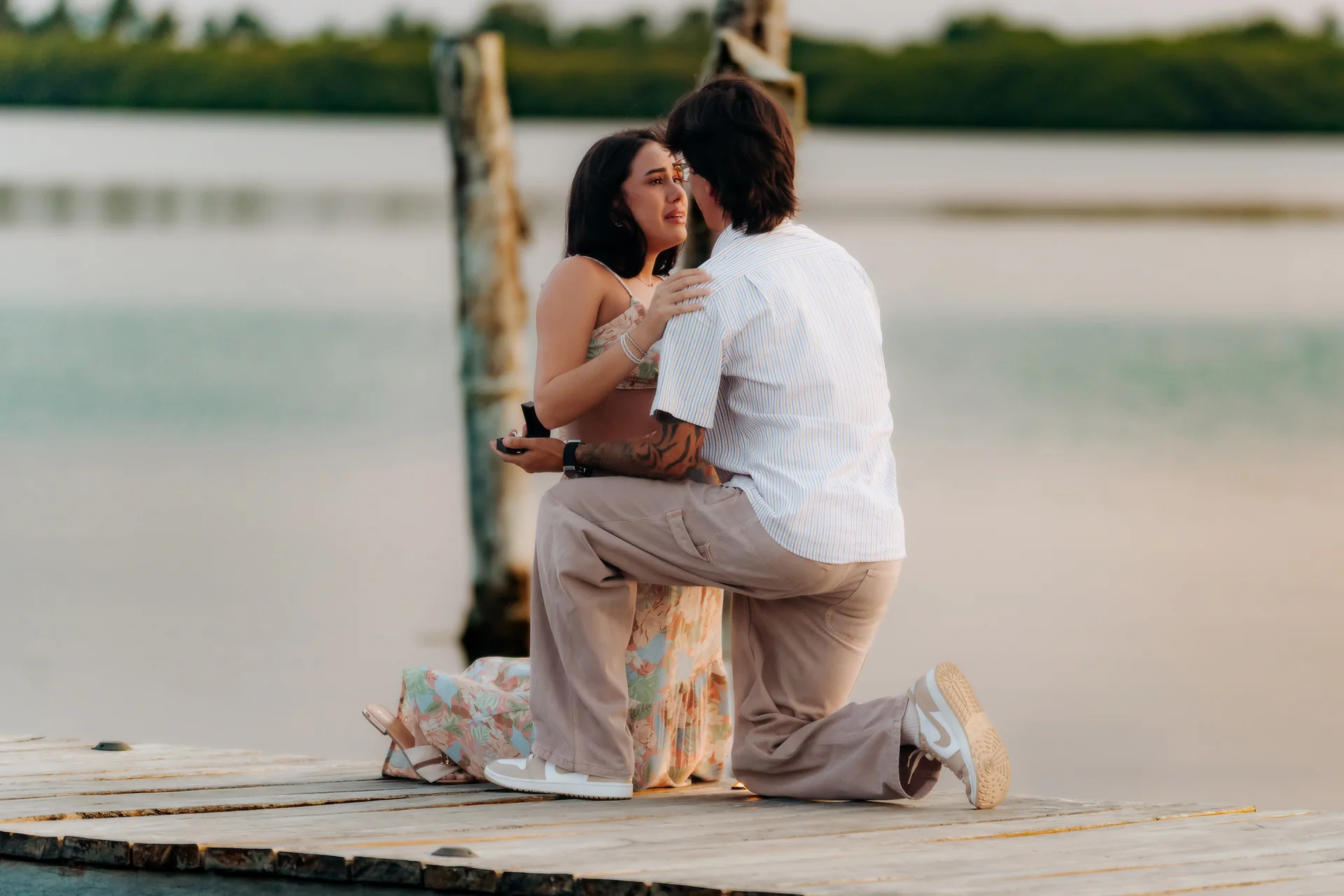Newly engaged couple walking hand in hand, Navios restaurant, Cancún