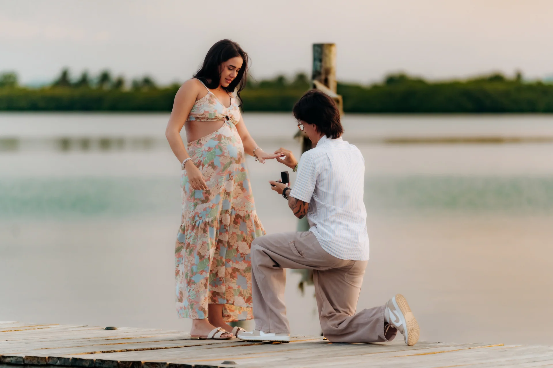 Partner leaning into the embrace after saying yes, Navios restaurant, Cancún