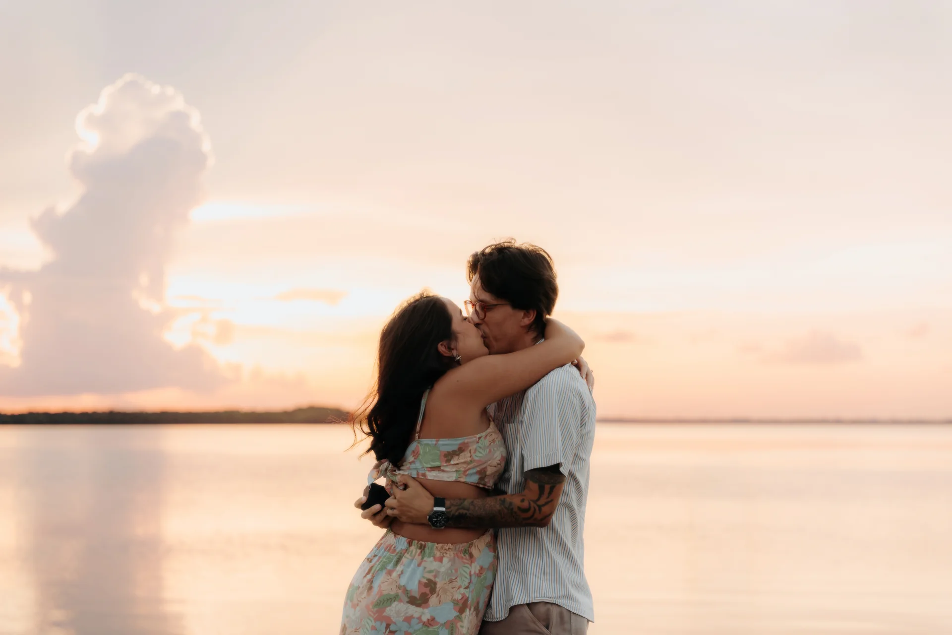 Newly engaged couple wrapped together, Navios restaurant, Cancún