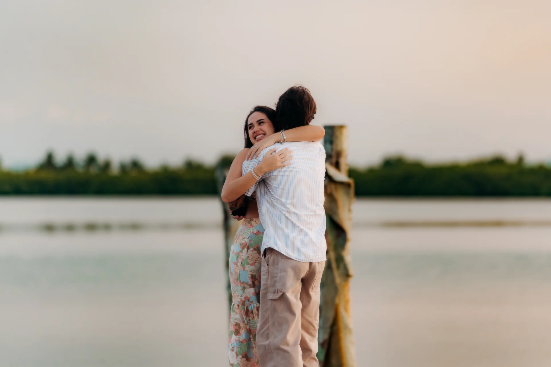 Couple embracing in the golden light, Navios restaurant, Cancún