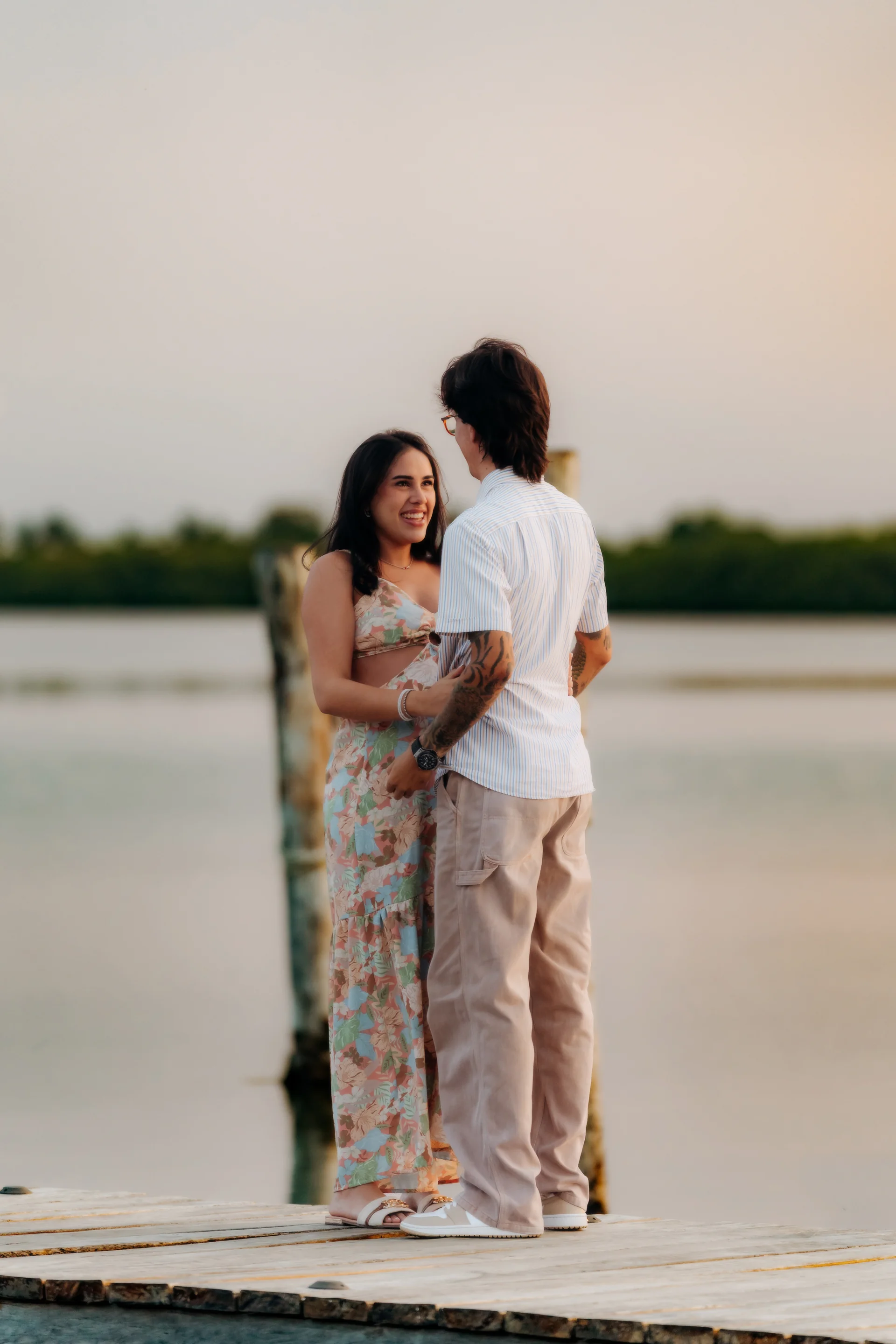 Couple pressing close after saying yes, Navios restaurant, Cancún