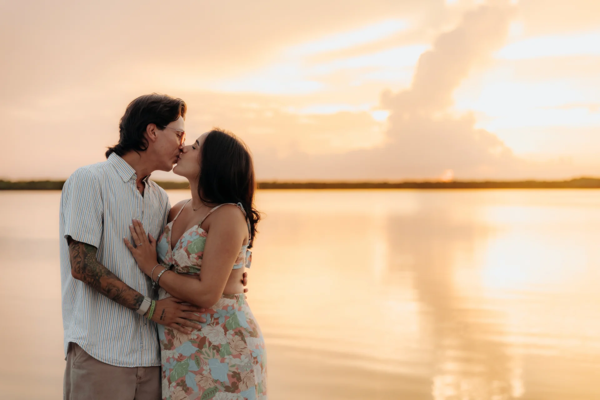 Engaged couple smiling into the light, Navios restaurant, Cancún