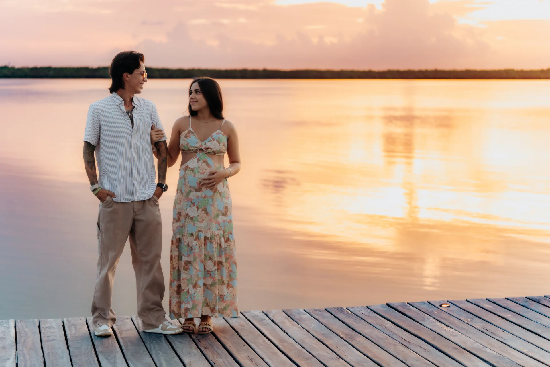 Couple celebrating their engagement in the breeze, Navios restaurant, Cancún