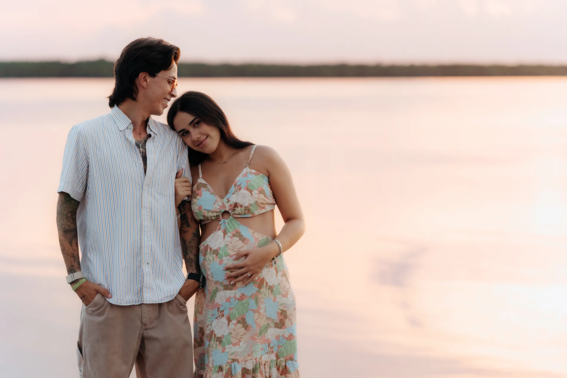 Couple standing together looking at the ring, Navios restaurant, Cancún