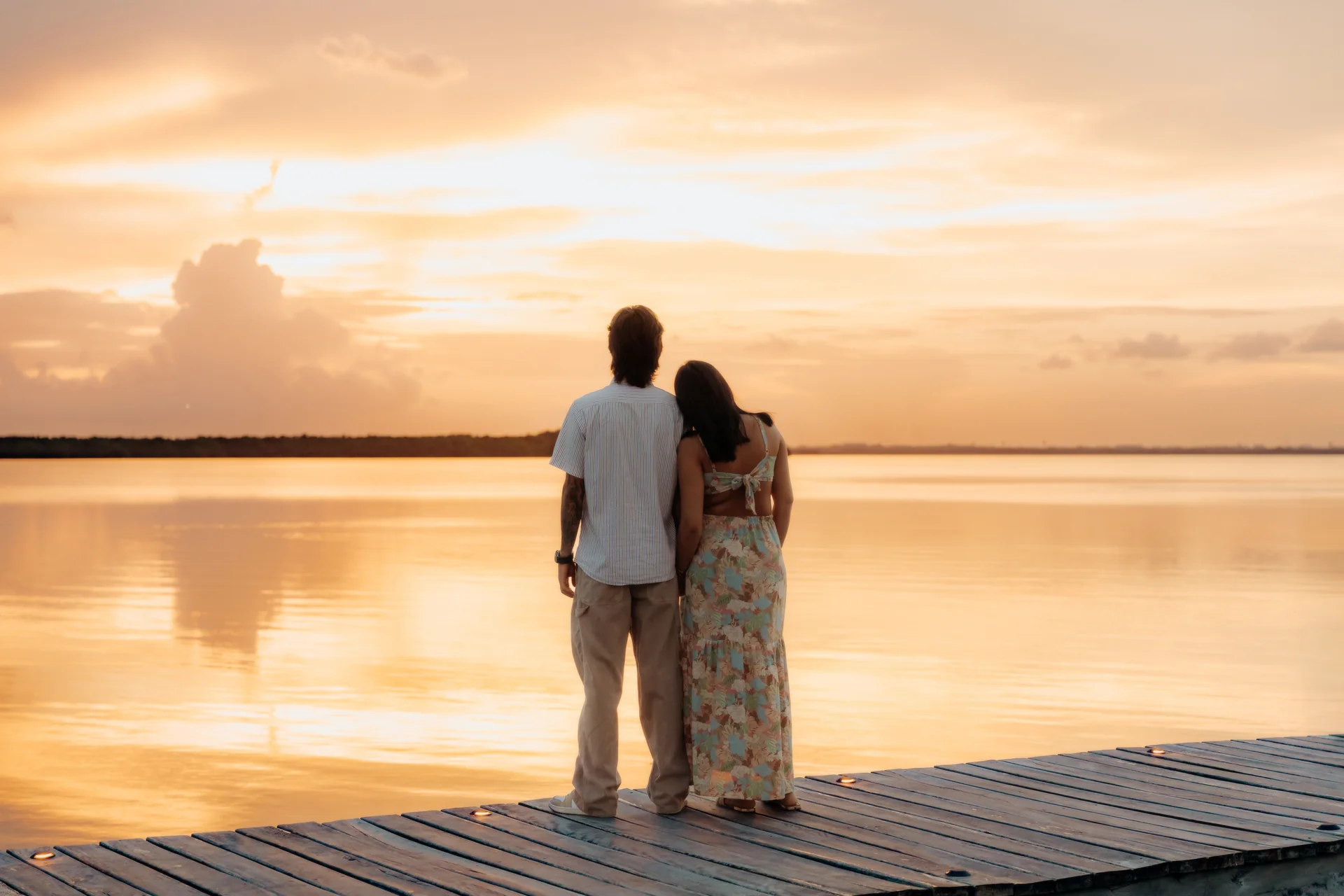 Couple embracing just after the proposal, Navios restaurant, Cancún