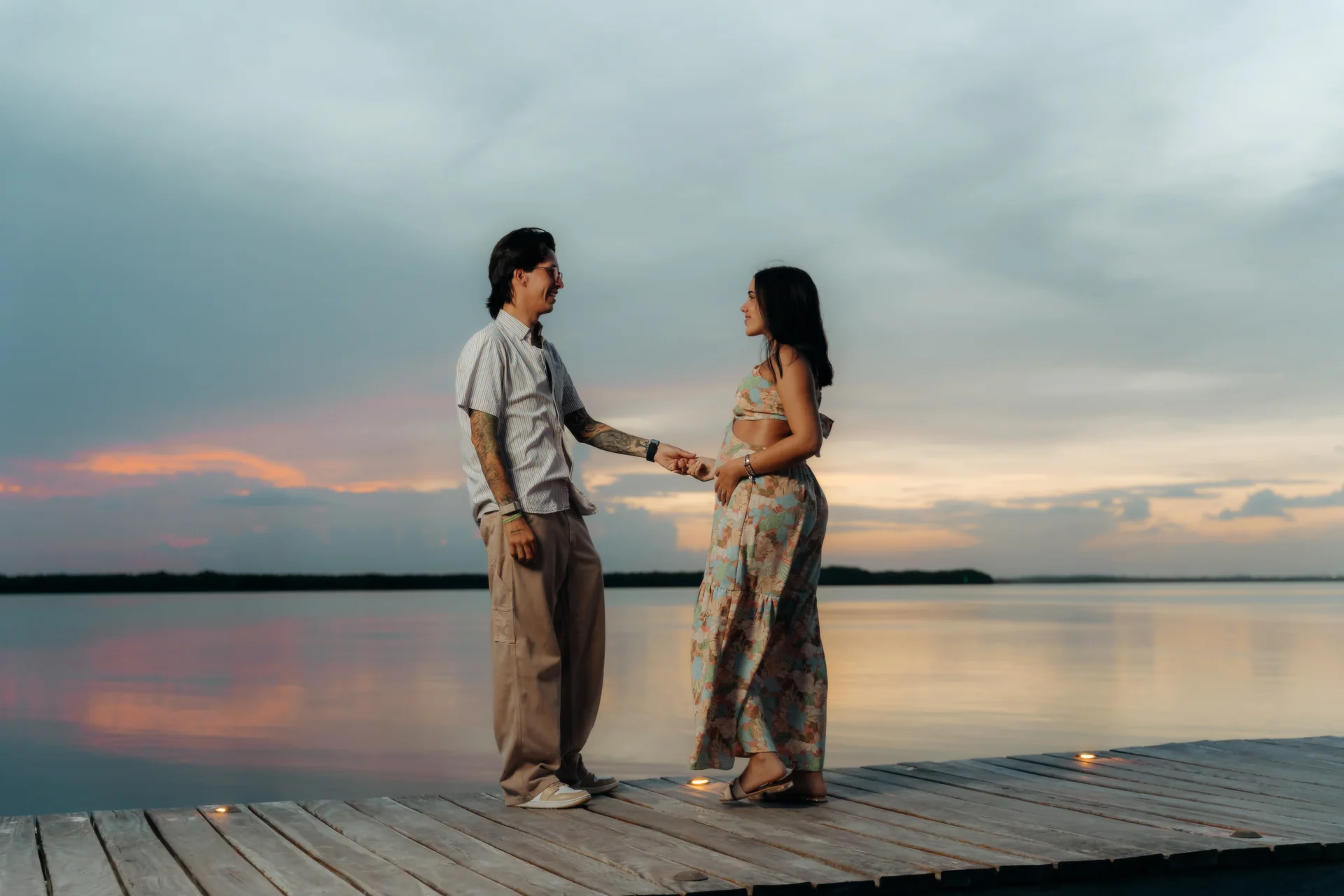 Couple walking the shoreline after the proposal, Navios restaurant, Cancún